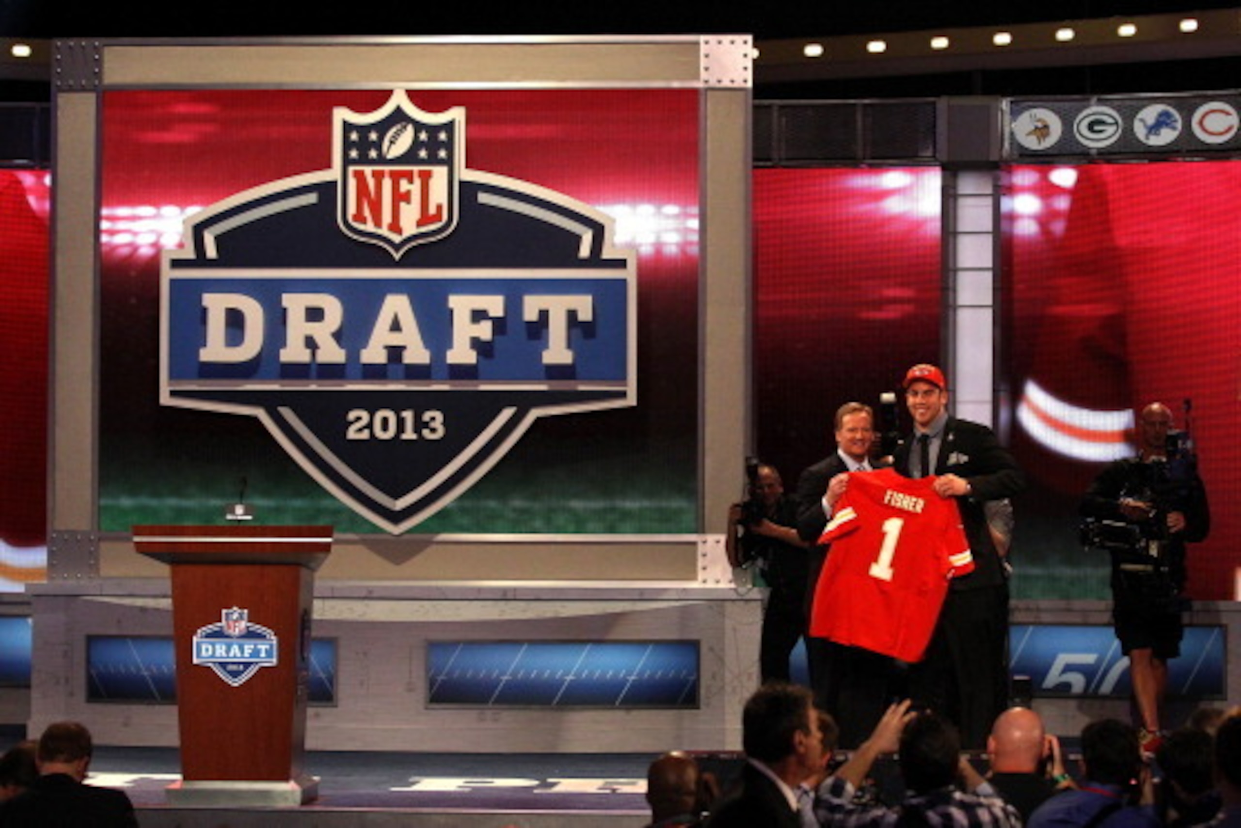 NEW YORK, NY - APRIL 25:  Eric Fisher (R) of Central Michigan Chippewas stands on stage with NFL Commissioner Roger Goodell after Fisher was picked #1 overall by the Kansas City Chiefs in the first round of the 2013 NFL Draft at Radio City Music Hall on A
