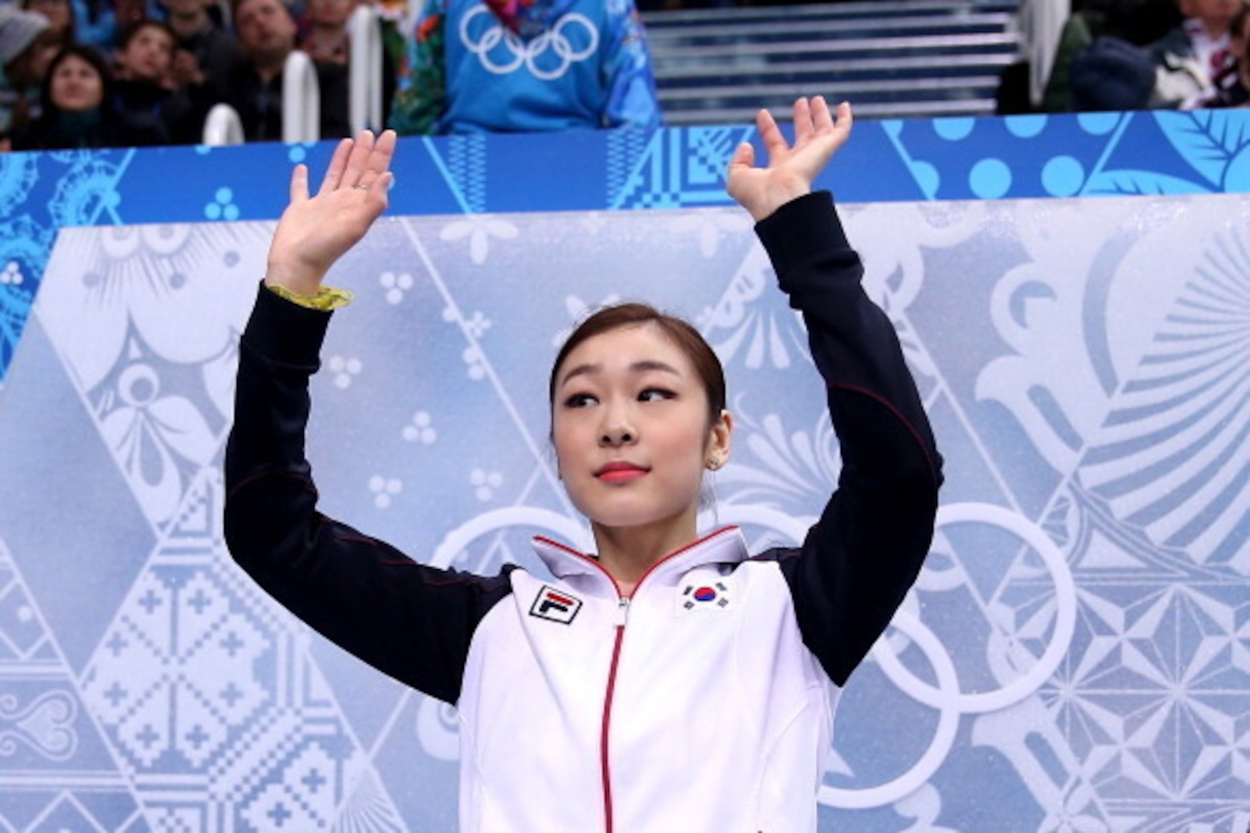 SOCHI, RUSSIA - FEBRUARY 19: Yuna Kim of South Korea waves to fans after her score was announced in the Figure Skating Ladies' Short Program on day 12 of the Sochi 2014 Winter Olympics at Iceberg Skating Palace on February 19, 2014 in Sochi, Russia. (Ph SOCHI, RUSSIA - FEBRUARY 19: Yuna Kim of South Korea waves to fans after her score was announced in the Figure Skating Ladies' Short Program on day 12 of the Sochi 2014 Winter Olympics at Iceberg Skating Palace on February 19, 2014 in Sochi, Russia. (Ph