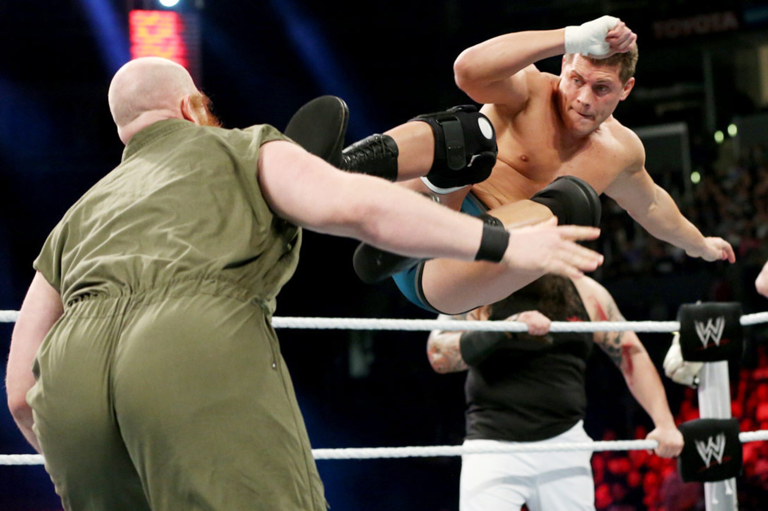 Cody Rhodes hits a dropkick on Erick Rowan.