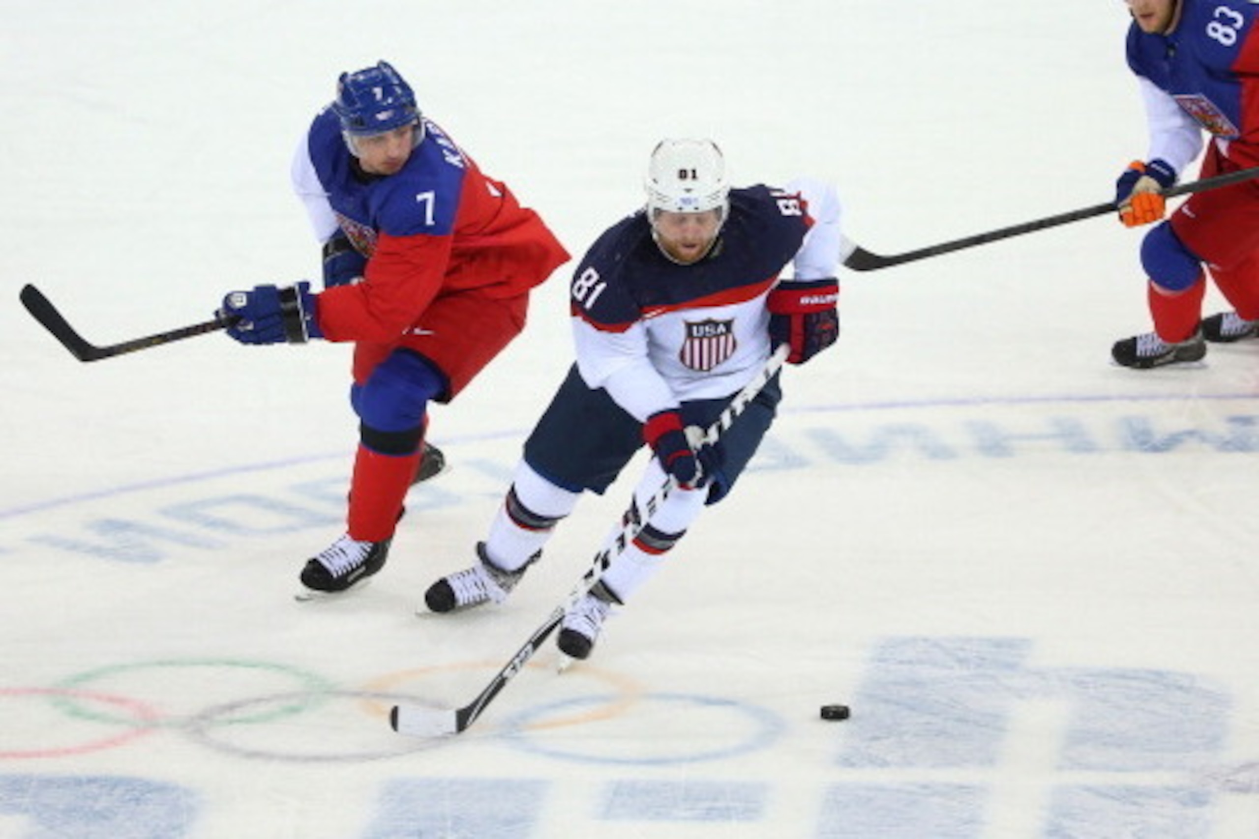 SOCHI, RUSSIA - FEBRUARY 19:  Phil Kessel #81 of the United States skates with the puck against the Czech Republic during the Men's Ice Hockey Quarterfinal Playoff on Day 12 of the 2014 Sochi Winter Olympics at Shayba Arena on February 19, 2014 in Sochi, 
