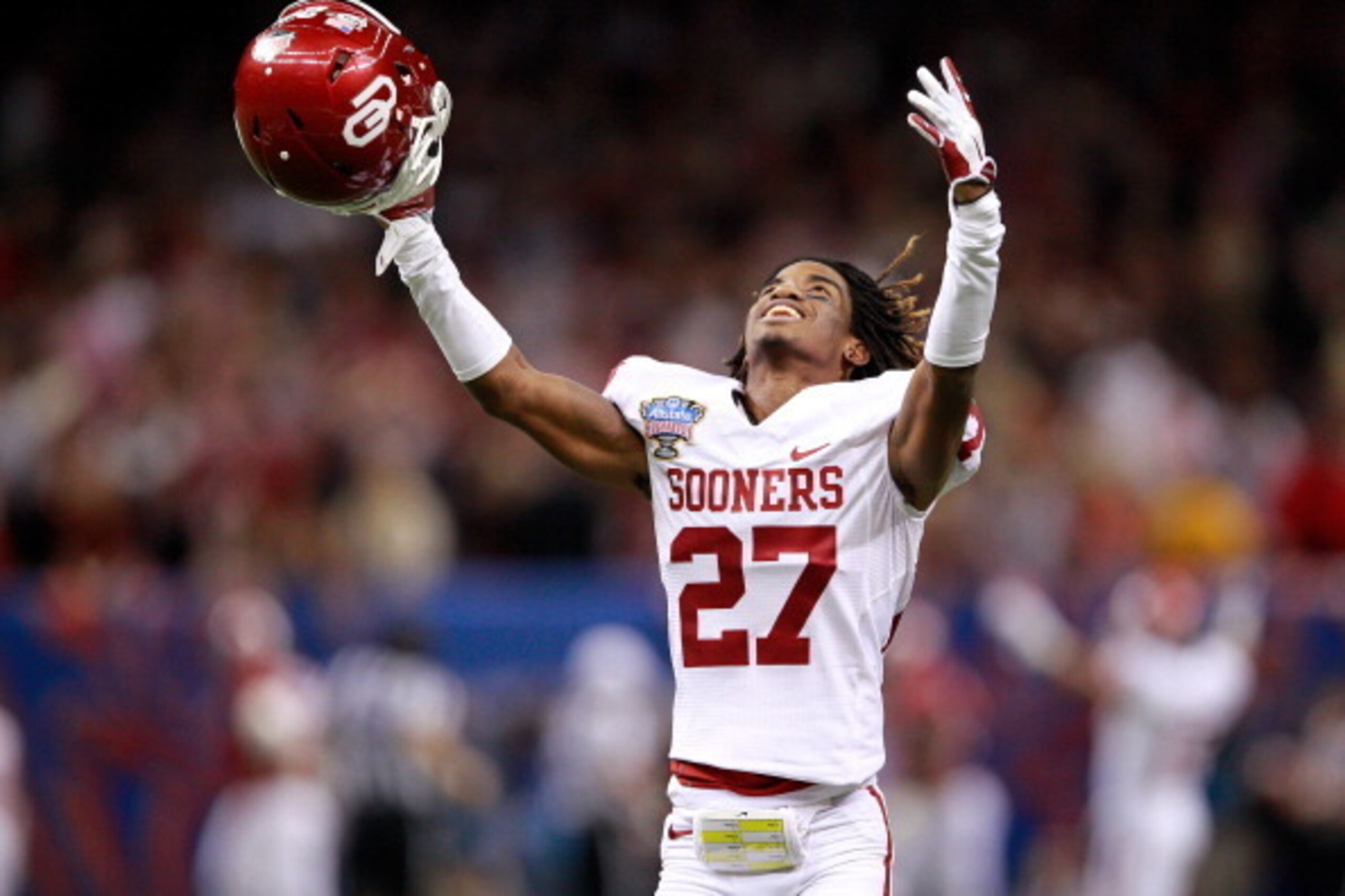 NEW ORLEANS, LA - JANUARY 02:  Dakota Austin #27 of the Oklahoma Sooners celebrates after defeating the Alabama Crimson Tide 45-31 during the Allstate Sugar Bowl at the Mercedes-Benz Superdome on January 2, 2014 in New Orleans, Louisiana.  (Photo by Stree
