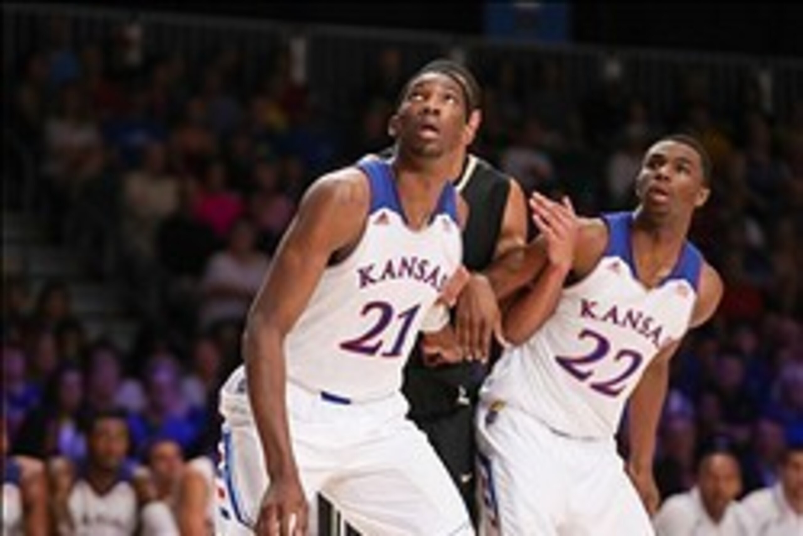 Nov 28, 2013; Paradise Island, BAHAMAS; Kansas Jayhawks center Joel Embiid (21) and guard Andrew Wiggins (22) look to rebound during the game against the Wake Forest Demon Deacons at the 2013 Battle 4 Atlantis in the Imperial Arena at the Atlantis Resort.
