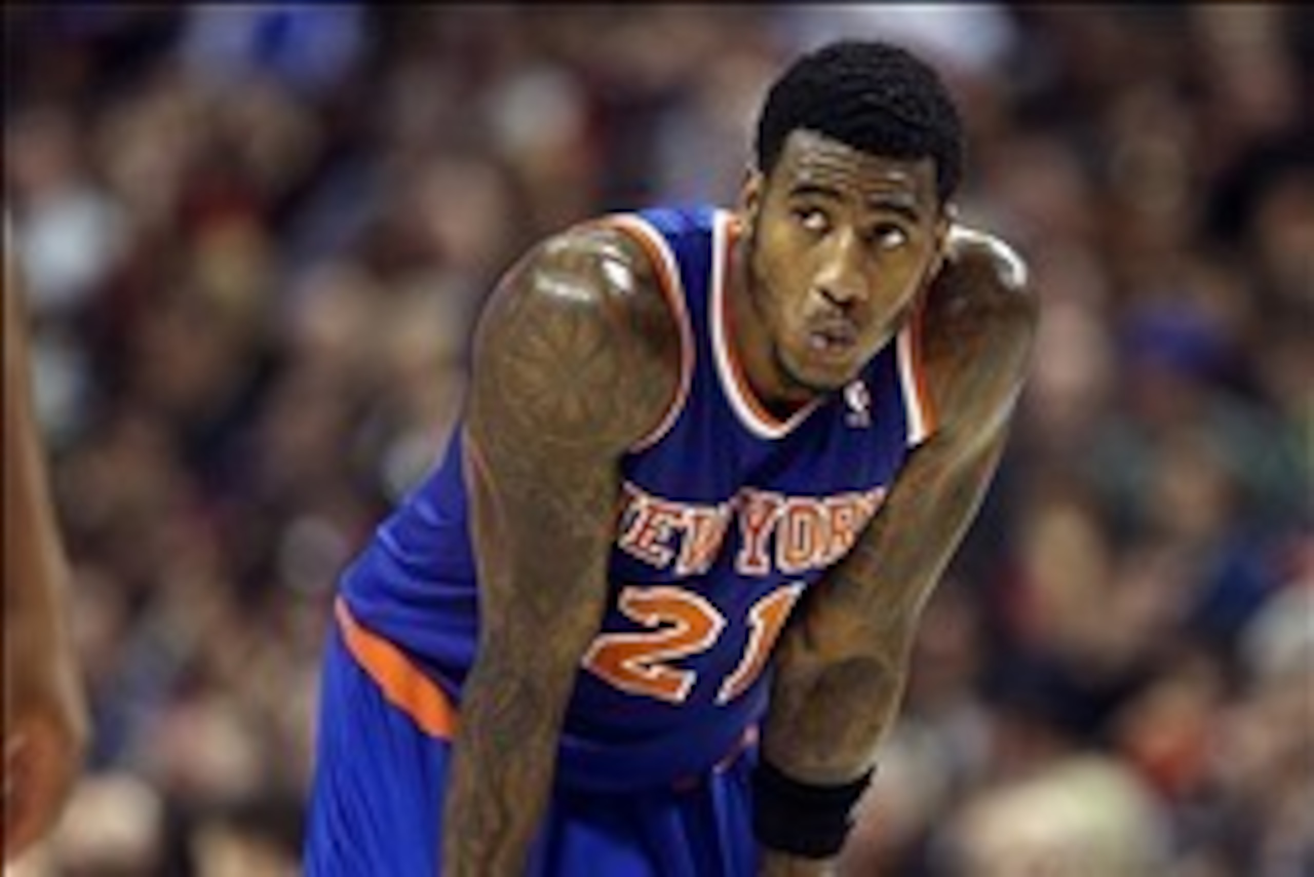 Dec 28, 2013; Toronto, Ontario, CAN; New York Knicks guard Iman Shumpert (21) looks on against the Toronto Raptors at Air Canada Centre. The Raptors beat the Knicks 115-100. Mandatory Credit: Tom Szczerbowski-USA TODAY Sports