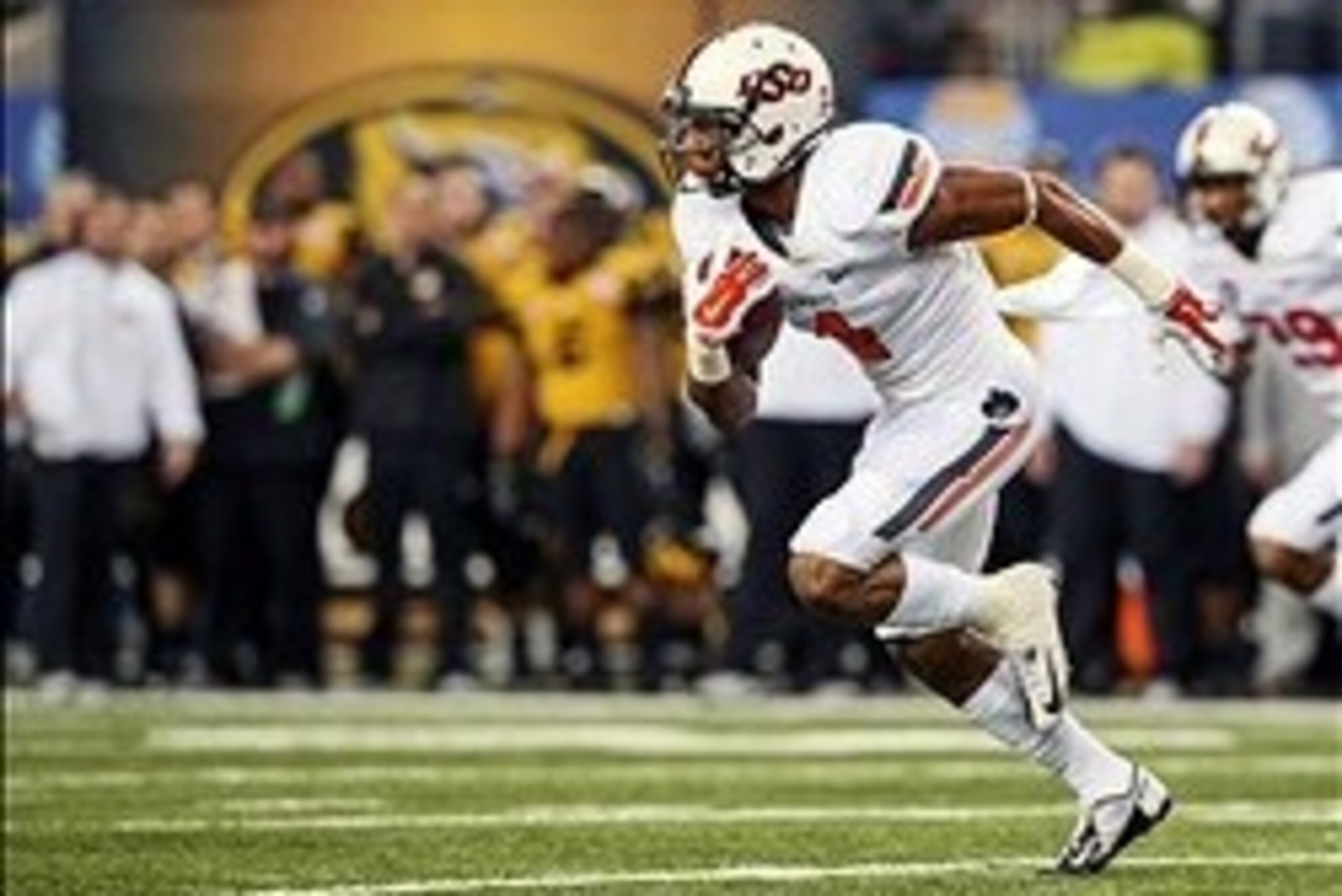 Jan 3, 2014; Arlington, TX, USA; Oklahoma State Cowboys cornerback Justin Gilbert (4) intercepts a pass and runs up the field during the game against the Missouri Tigers in the 2014 Cotton Bowl at AT&T Stadium. Missouri won 41-31. Mandatory Credit: Kevin Jan 3, 2014; Arlington, TX, USA; Oklahoma State Cowboys cornerback Justin Gilbert (4) intercepts a pass and runs up the field during the game against the Missouri Tigers in the 2014 Cotton Bowl at AT&T Stadium. Missouri won 41-31. Mandatory Credit: Kevin