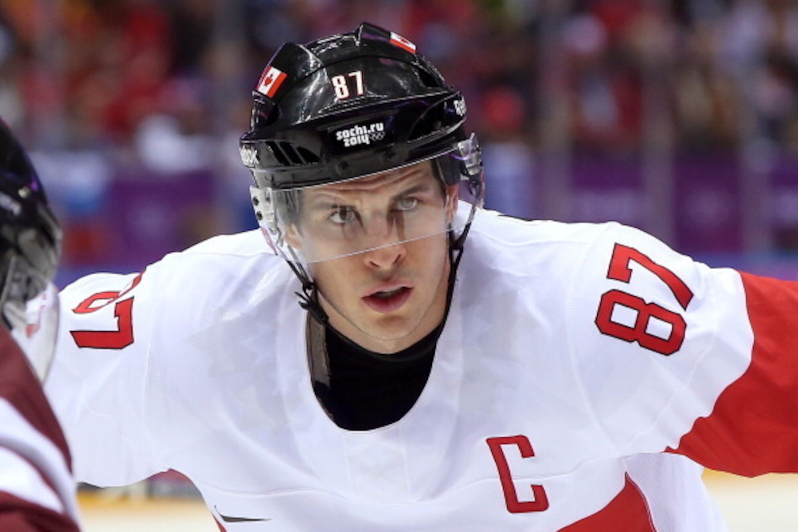 SOCHI, RUSSIA - FEBRUARY 19: Sidney Crosby #87 of Canada faces off against Latvia during the Men's Ice Hockey Quarterfinal Playoff on Day 12 of the 2014 Sochi Winter Olympics at Bolshoy Ice Dome on February 19, 2014 in Sochi, Russia. (Photo by Bruce Ben SOCHI, RUSSIA - FEBRUARY 19: Sidney Crosby #87 of Canada faces off against Latvia during the Men's Ice Hockey Quarterfinal Playoff on Day 12 of the 2014 Sochi Winter Olympics at Bolshoy Ice Dome on February 19, 2014 in Sochi, Russia. (Photo by Bruce Ben