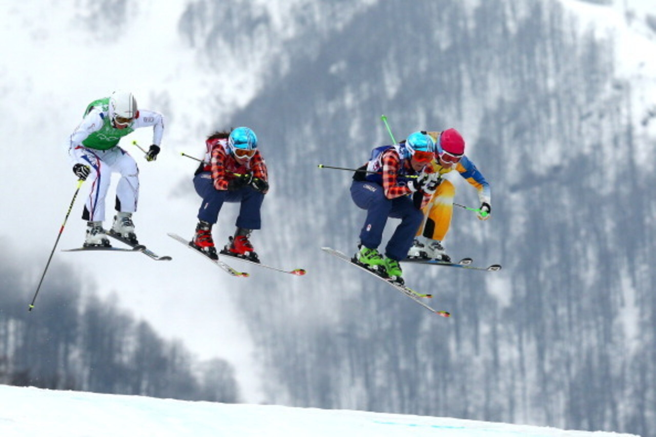 SOCHI, RUSSIA - FEBRUARY 21:  (L-R) Ophelie David of France, Kelsey Serwa of Canada, Marielle Thompson of Canada and Anna Holmlund of Sweden compete in the Freestyle Skiing Womens' Ski Cross Final on day 14 of the 2014 Winter Olympics at Rosa Khutor Extre