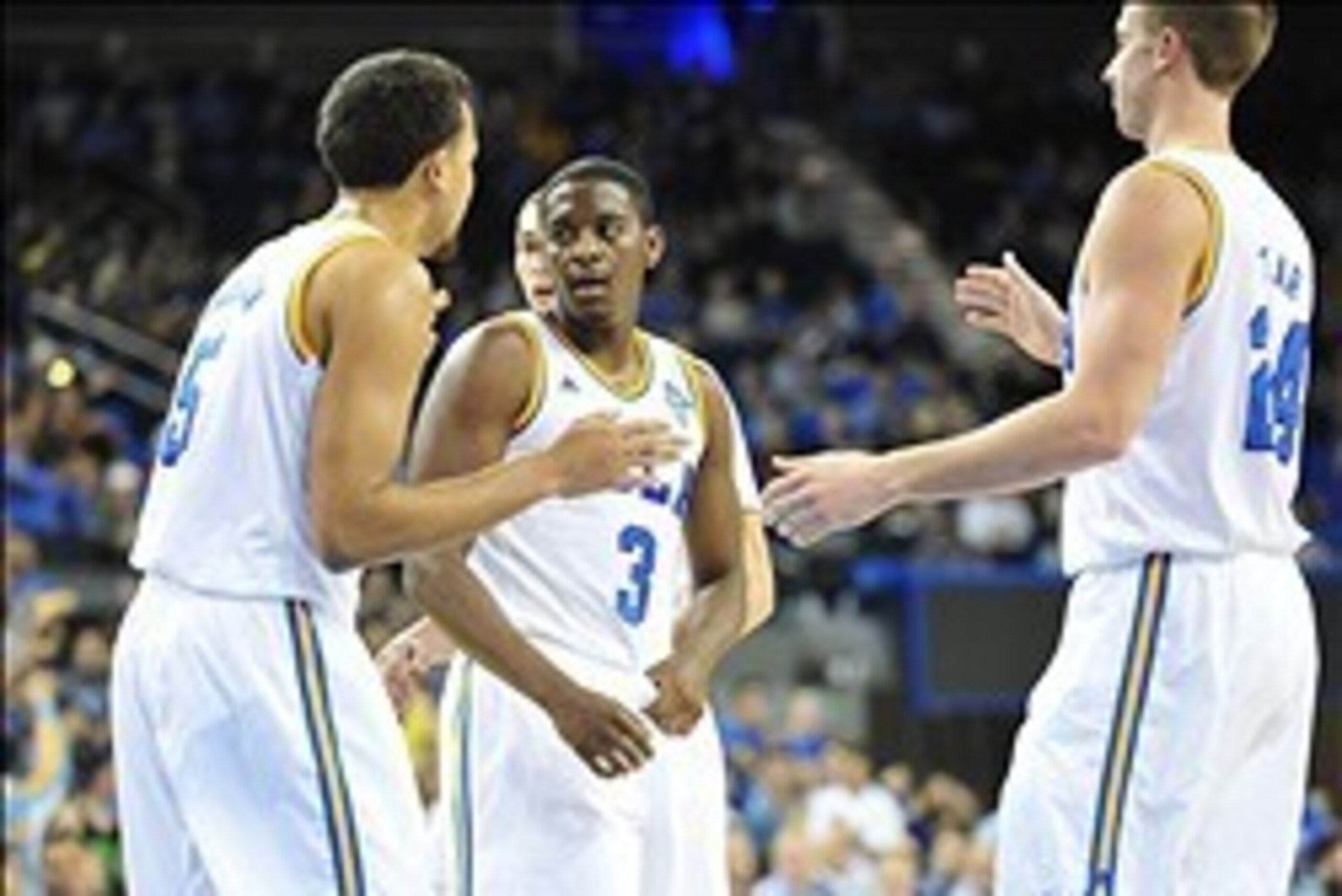 February 13, 2014; Los Angeles, CA, USA; UCLA Bruins guard Jordan Adams (3) celebrates with guard/forward Kyle Anderson (5) and forward Travis Wear (24) after scoring a basket against the Colorado Buffaloes during the second half at Pauley Pavilion. Manda