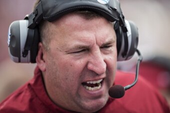 OXFORD, MISSISSIPPI - NOVEMBER 9:  Head coach Bret Bielema of the Arkansas Razorbacks talks to his team during a game against the Ole Miss Rebels at Vaught-Hemingway Stadium on November 9, 2013 in Oxford, Mississippi.  The Rebels defeated the Razorbacks 3