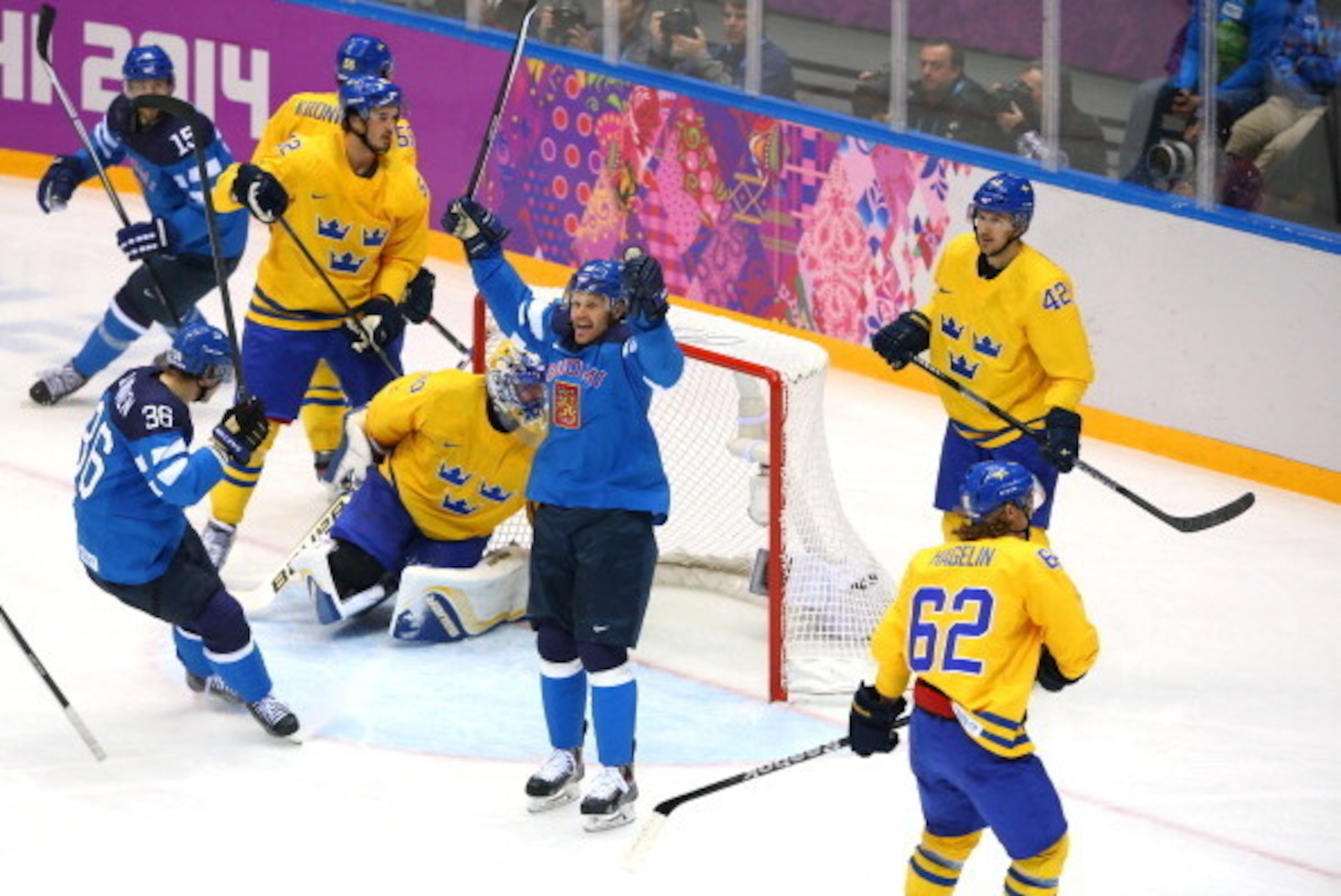 SOCHI, RUSSIA - FEBRUARY 21: Olli Jokinen #12 of Finland celebrates after scoring in the second period against Henrik Lundqvist #30 of Sweden during the Men's Ice Hockey Semifinal Playoff on Day 14 of the 2014 Sochi Winter Olympics at Bolshoy Ice Dome on 