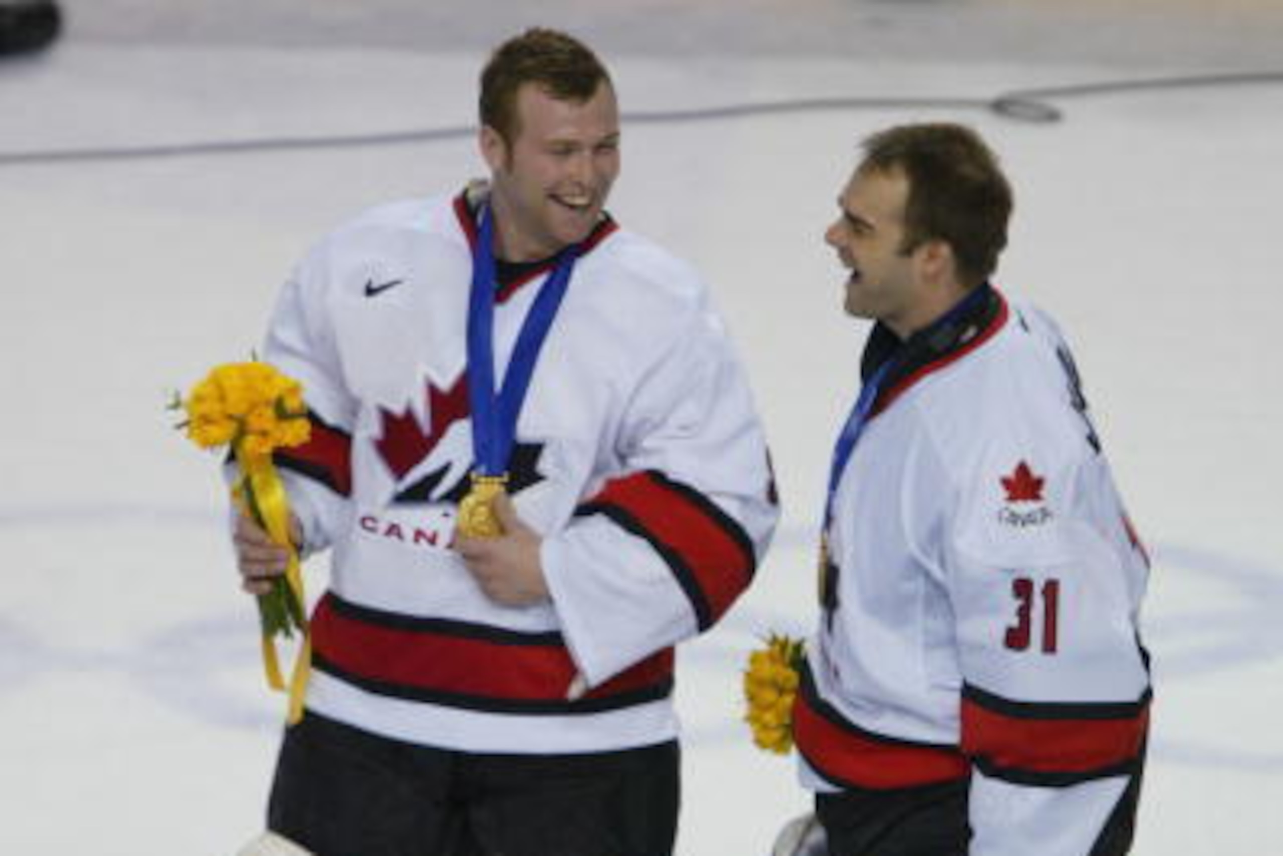 24 Feb 2002:   Martin Brodeur #30 of Canada with Curtis Joseph #31 enjoy their gold-medal celebration after defeating the USA, 5-2, in the men's gold medal game at the Salt Lake City Winter Olympic Games at the E Center in Salt Lake City, Utah. DIGITAL IM