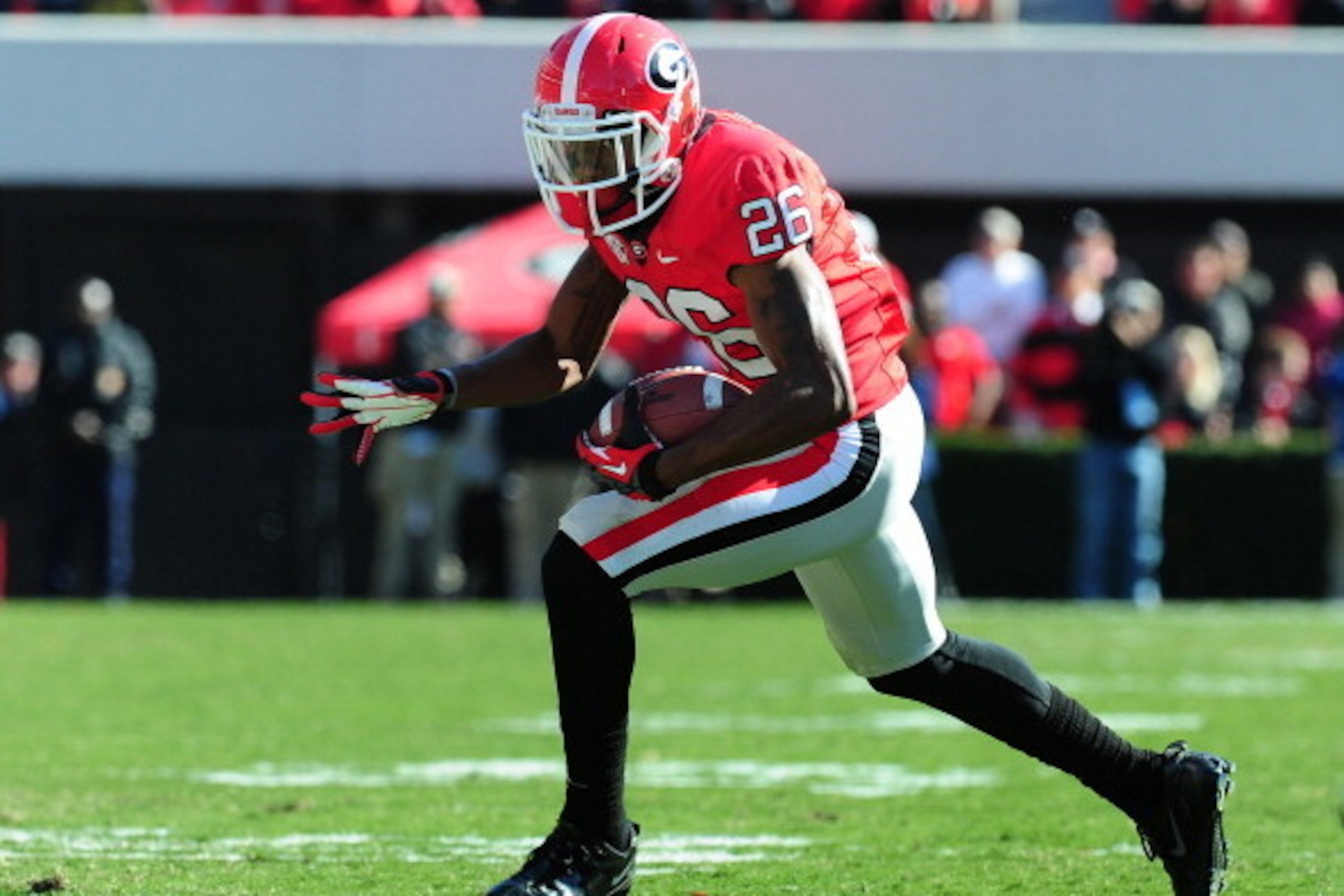 ATHENS, GA - NOVEMBER 24: Malcolm Mitchell #26 of the Georgia Bulldogs runs with a catch against the Georgia Tech Yellow Jackets at Sanford Stadium on November 24, 2012 in Athens, Georgia. (Photo by Scott Cunningham/Getty Images)