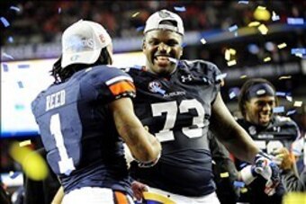 Dec 7, 2013; Atlanta, GA, USA; Auburn Tigers wide receiver Trovon Reed (1) and Auburn Tigers offensive linesman Greg Robinson (73) celebrate after the 2013 SEC Championship game against the Missouri Tigers at Georgia Dome. The Auburn Tigers defeated the M