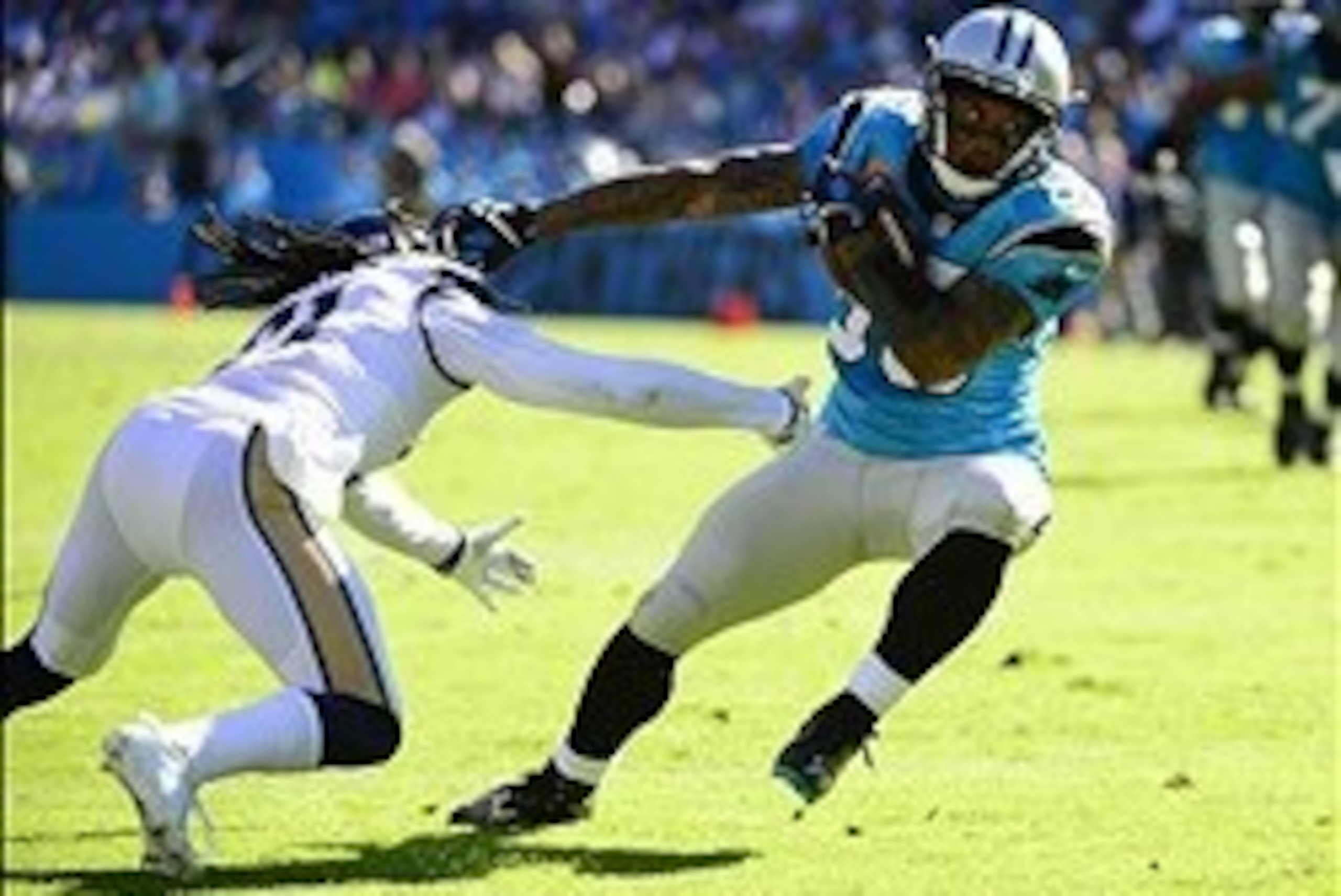 Oct 20, 2013; Charlotte, NC, USA; Carolina Panthers wide receiver Steve Smith (89) scores a touchdown in the third quarter past St. Louis Rams cornerback Janoris Jenkins (21) defends at Bank of America Stadium. Mandatory Credit: Bob Donnan-USA TODAY Sport
