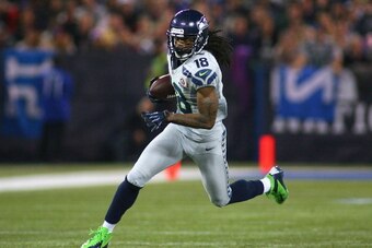TORONTO, ON - DECEMBER 16:  Sidney Rice #18 of the Seattle Seahawks runs after a catch against the Buffalo Bills at Rogers Centre on December 16, 2012 in Toronto, Ontario, Canada.Seattle won 50-17.  (Photo by Rick Stewart/Getty Images)