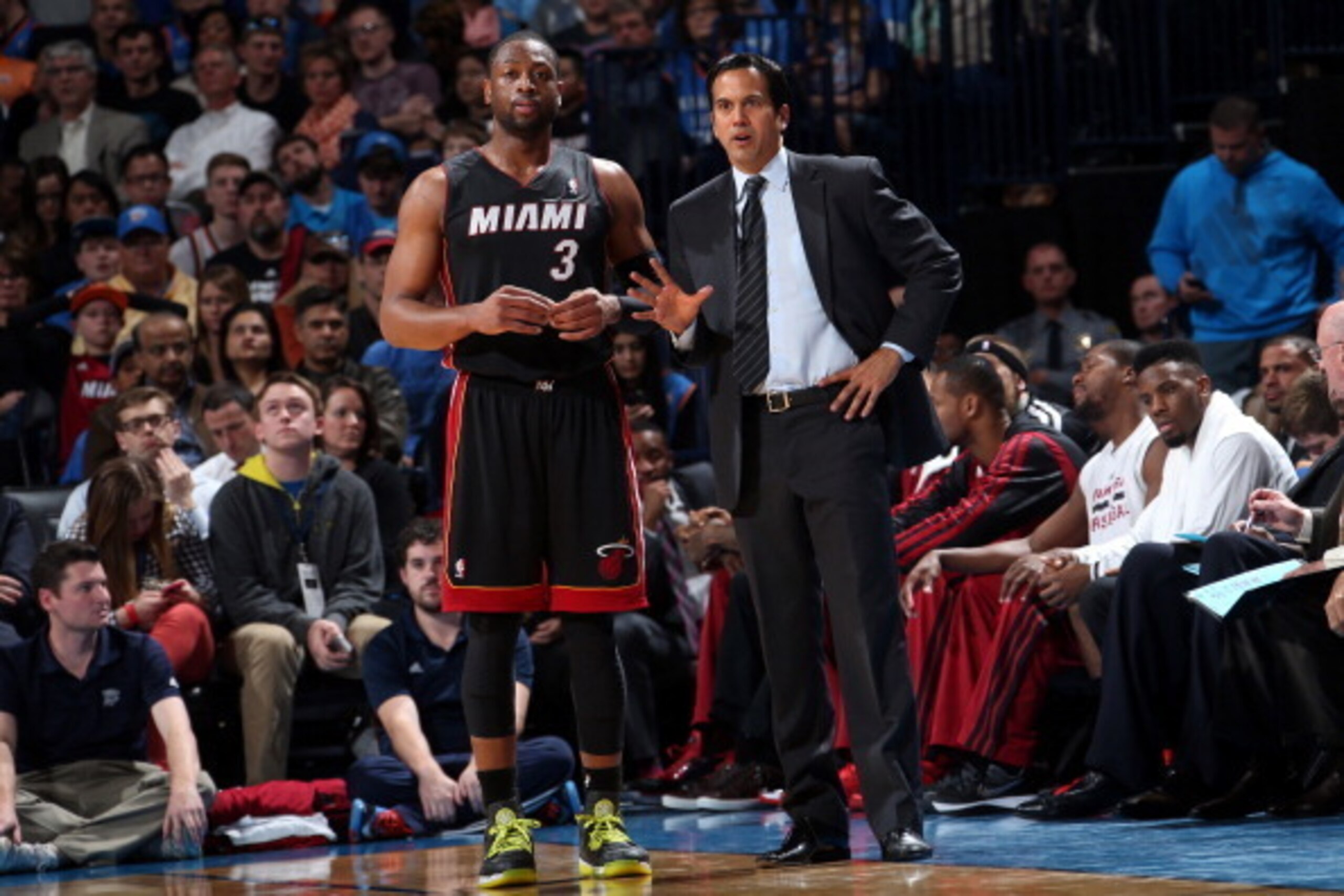 OKLAHOMA CITY, OK - FEBRUARY 20: Dwyane Wade #3 of the Miami Heat talks with Head Coach Erik Spoelstra during the game against the Oklahoma City Thunder on February 20, 2014 at the Chesapeake Energy Arena in Oklahoma City, Oklahoma. NOTE TO USER: User exp