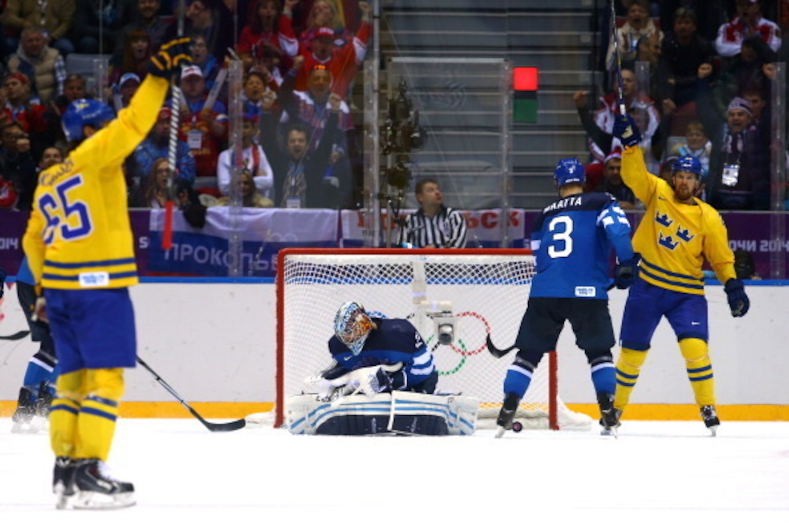 SOCHI, RUSSIA - FEBRUARY 21: Erik Karlsson #65 of Sweden celebrates a second-period goal with teammate Daniel Sedin #22 against Kari Lehtonen #32 of Finland during the Men's Ice Hockey Semifinal Playoff on Day 14 of the 2014 Sochi Winter Olympics at Bol SOCHI, RUSSIA - FEBRUARY 21: Erik Karlsson #65 of Sweden celebrates a second-period goal with teammate Daniel Sedin #22 against Kari Lehtonen #32 of Finland during the Men's Ice Hockey Semifinal Playoff on Day 14 of the 2014 Sochi Winter Olympics at Bol