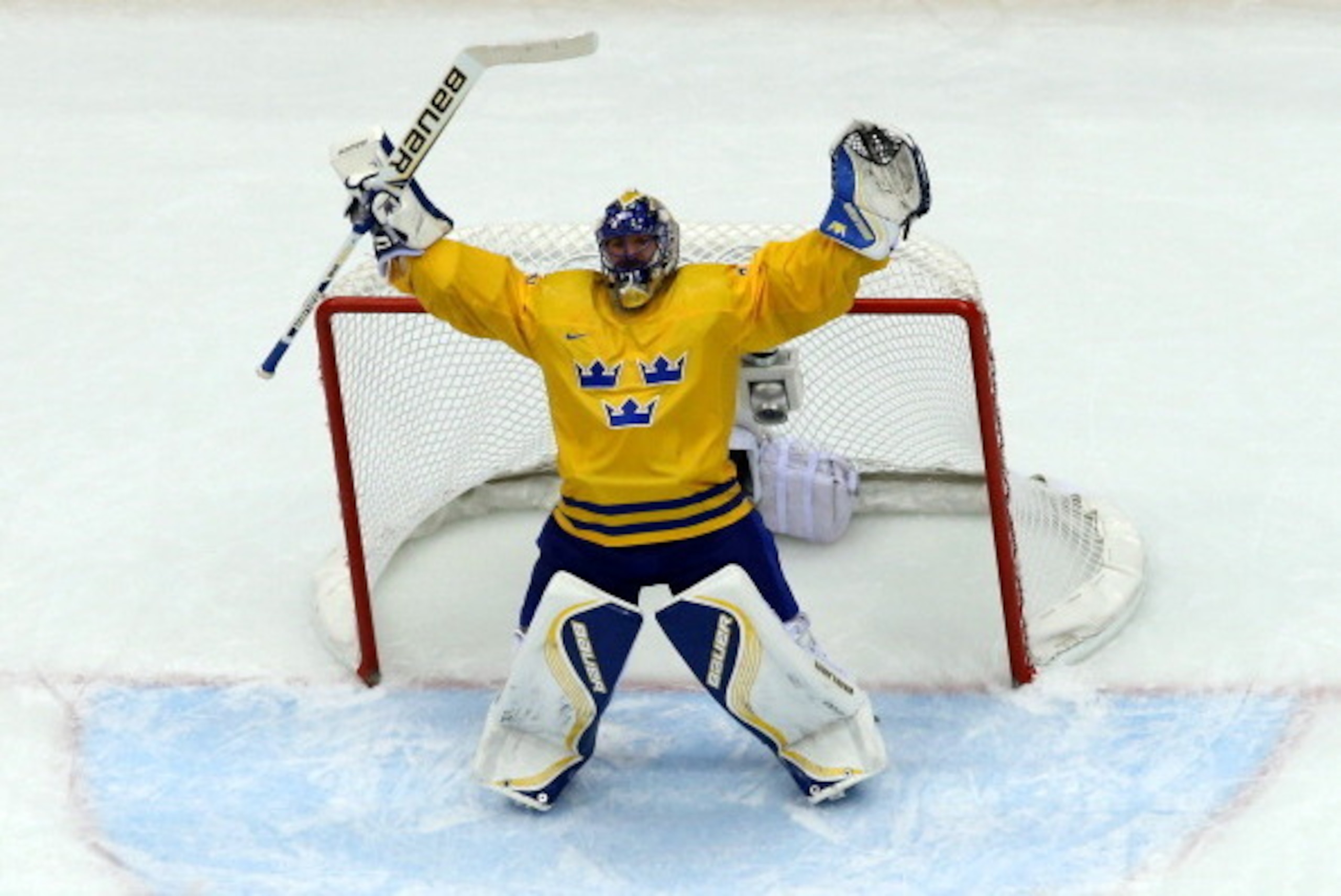 SOCHI, RUSSIA - FEBRUARY 21:  Henrik Lundqvist #30 of Sweden celebrates after defeating Finland 2-1 during the Men's Ice Hockey Semifinal Playoff on Day 14 of the 2014 Sochi Winter Olympics at Bolshoy Ice Dome on February 21, 2014 in Sochi, Russia.  (Phot