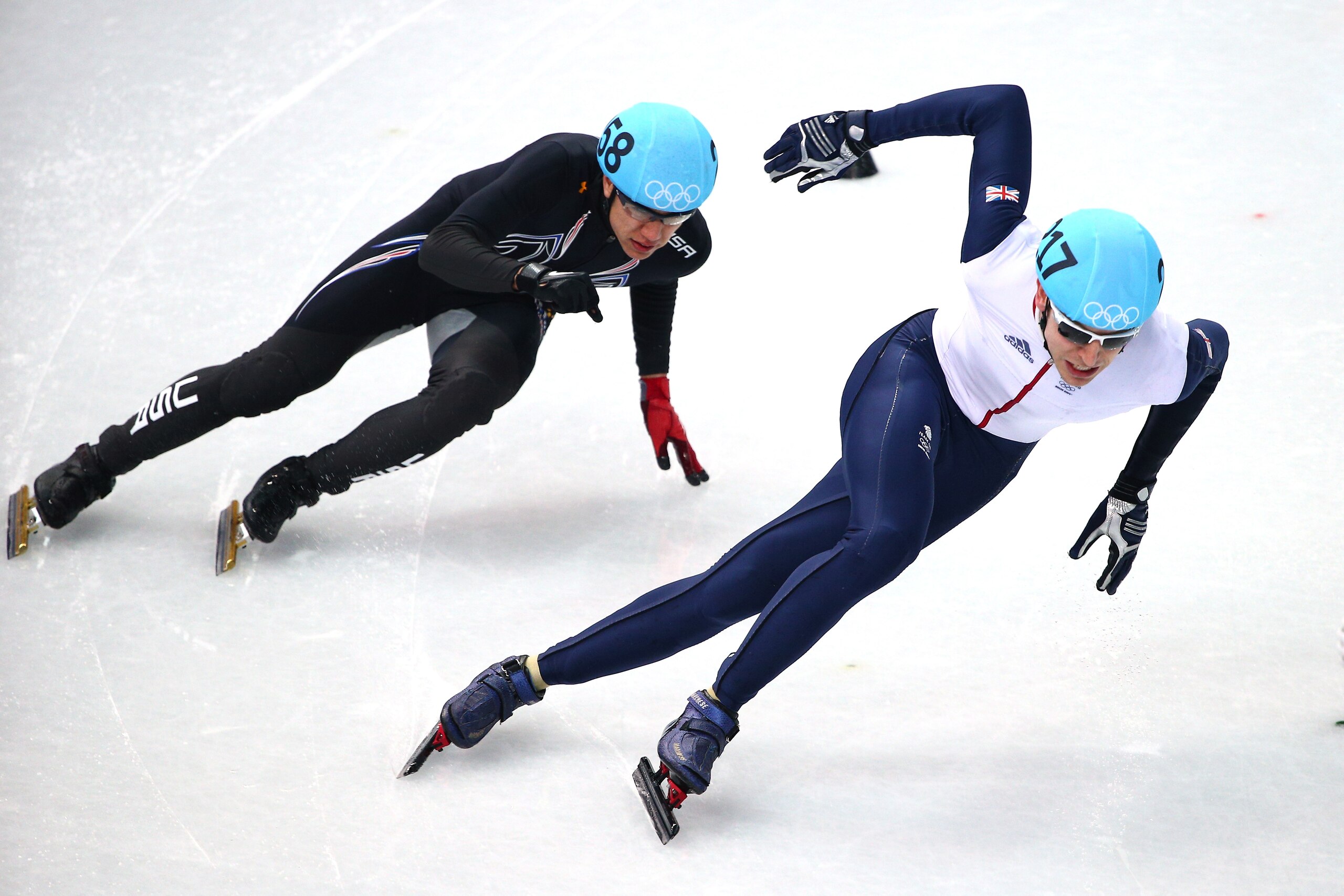 SOCHI, RUSSIA - FEBRUARY 21:  Jon Eley (R) of Great Britain leads to J.R. Celski of the United States  in the Short Track Men's 500m Final B on day fourteen of the 2014 Sochi Winter Olympics at Iceberg Skating Palace on February 21, 2014 in Sochi, Russia.