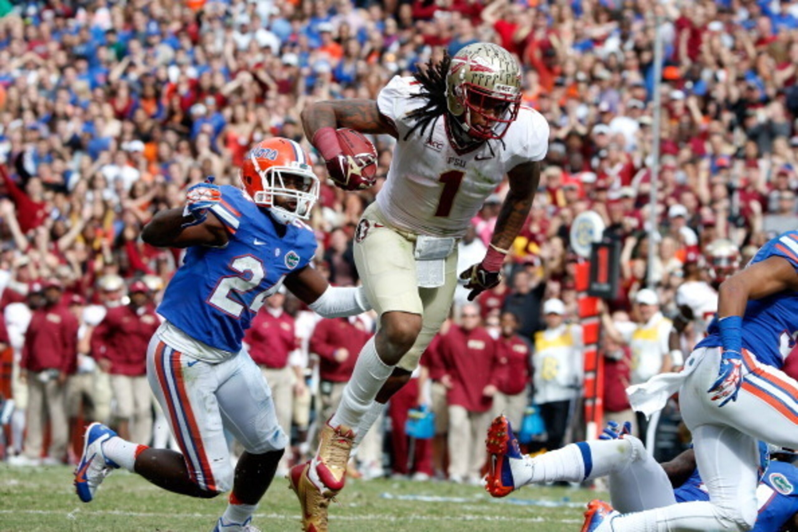 GAINESVILLE, FL - NOVEMBER 30:  Kelvin Benjamin #1 of the Florida State Seminoles runs for a touchdown during the game against the Florida Gators on November 30, 2013 in Gainesville, Florida.  (Photo by Sam Greenwood/Getty Images)
