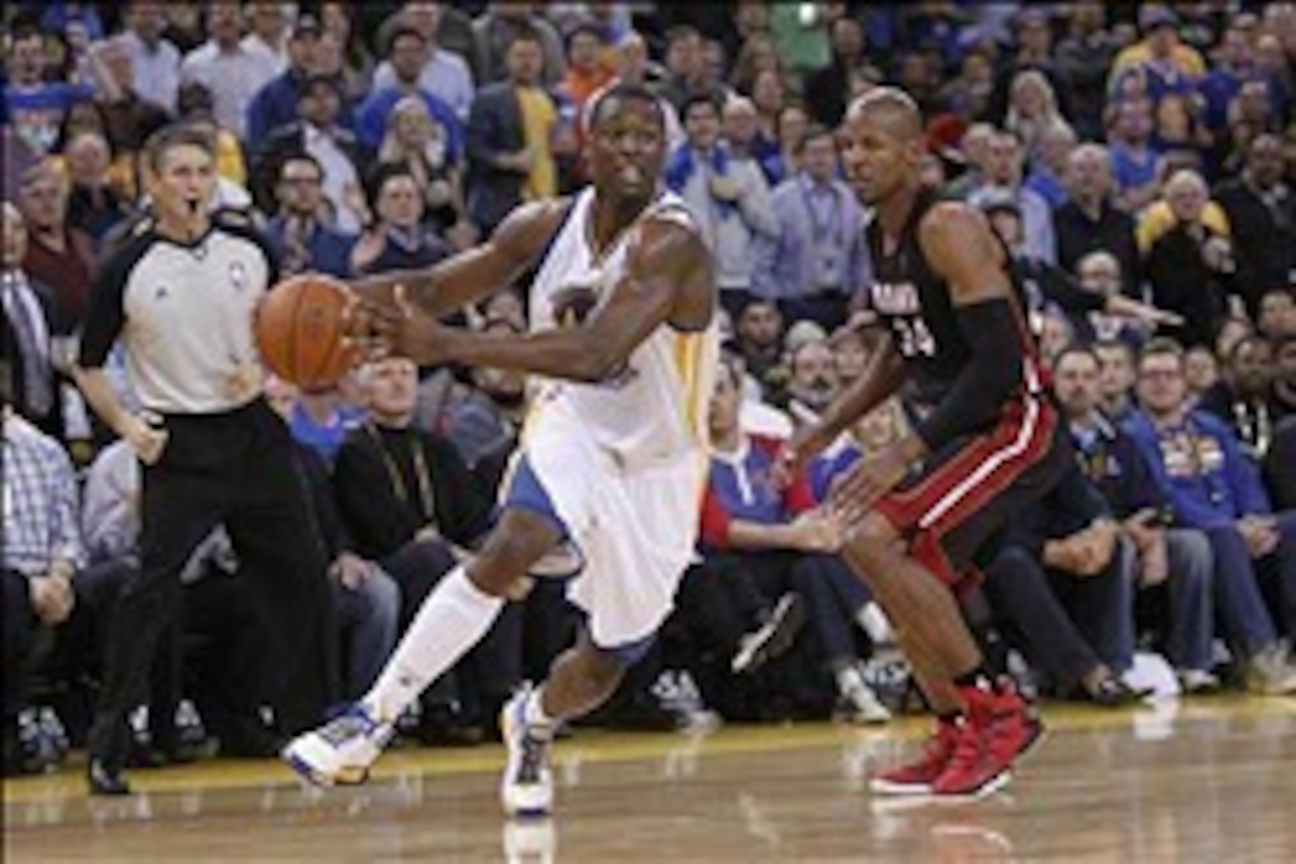 Feb 12, 2014; Oakland, CA, USA; Golden State Warriors forward Harrison Barnes (40) moves past Miami Heat guard Ray Allen (34) in the third quarter at Oracle Arena. The Heat defeated the Warriors 111-110. Mandatory Credit: Cary Edmondson-USA TODAY Sports