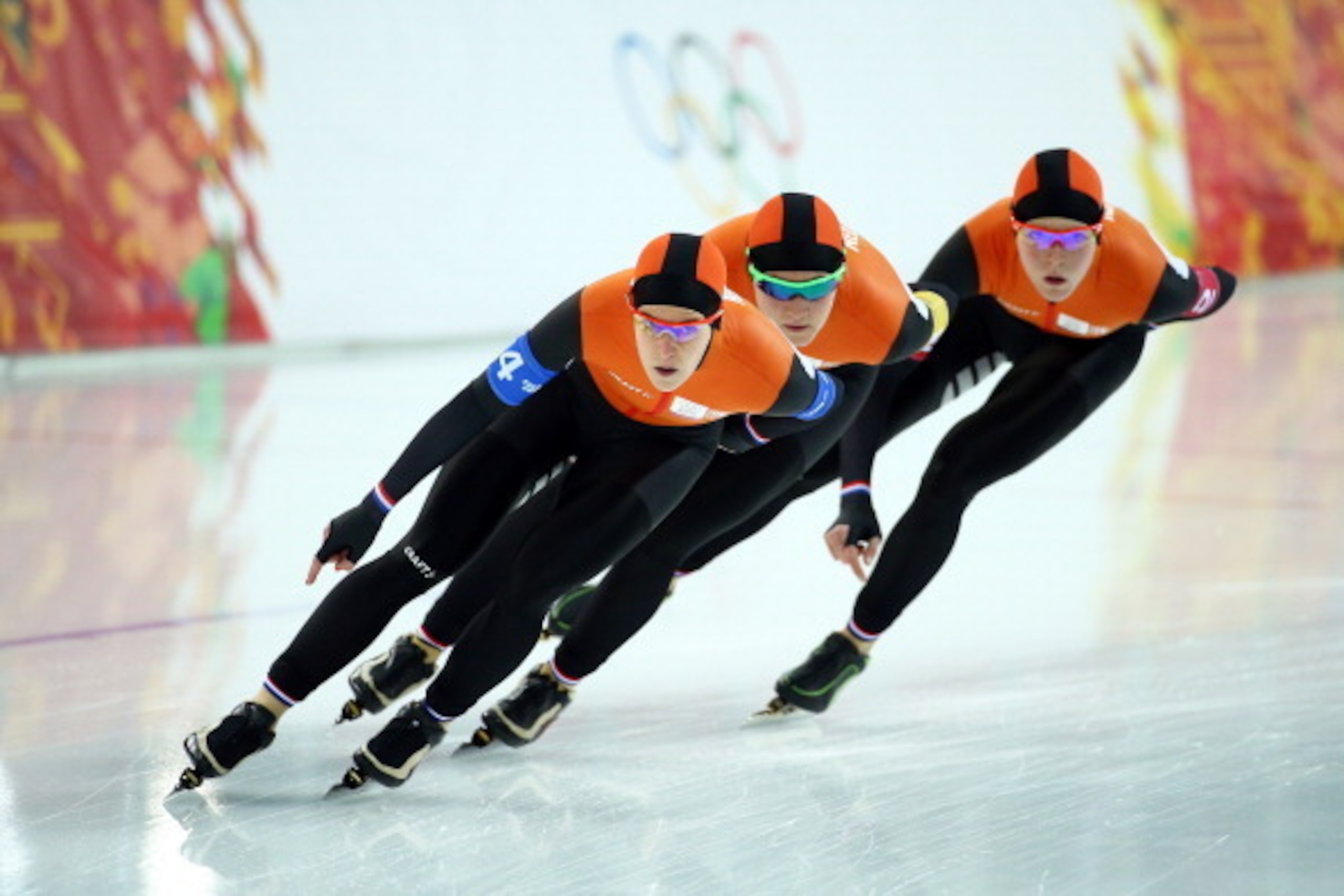 SOCHI, RUSSIA - FEBRUARY 21:  Jorien ter Mors, Lotte van Beek and Ireen Wust of the Netherlands compete during the Women's Team Pursuit Quarterfinals Speed Skating event on day fourteen of the Sochi 2014 Winter Olympics at Adler Arena Skating Center on Fe