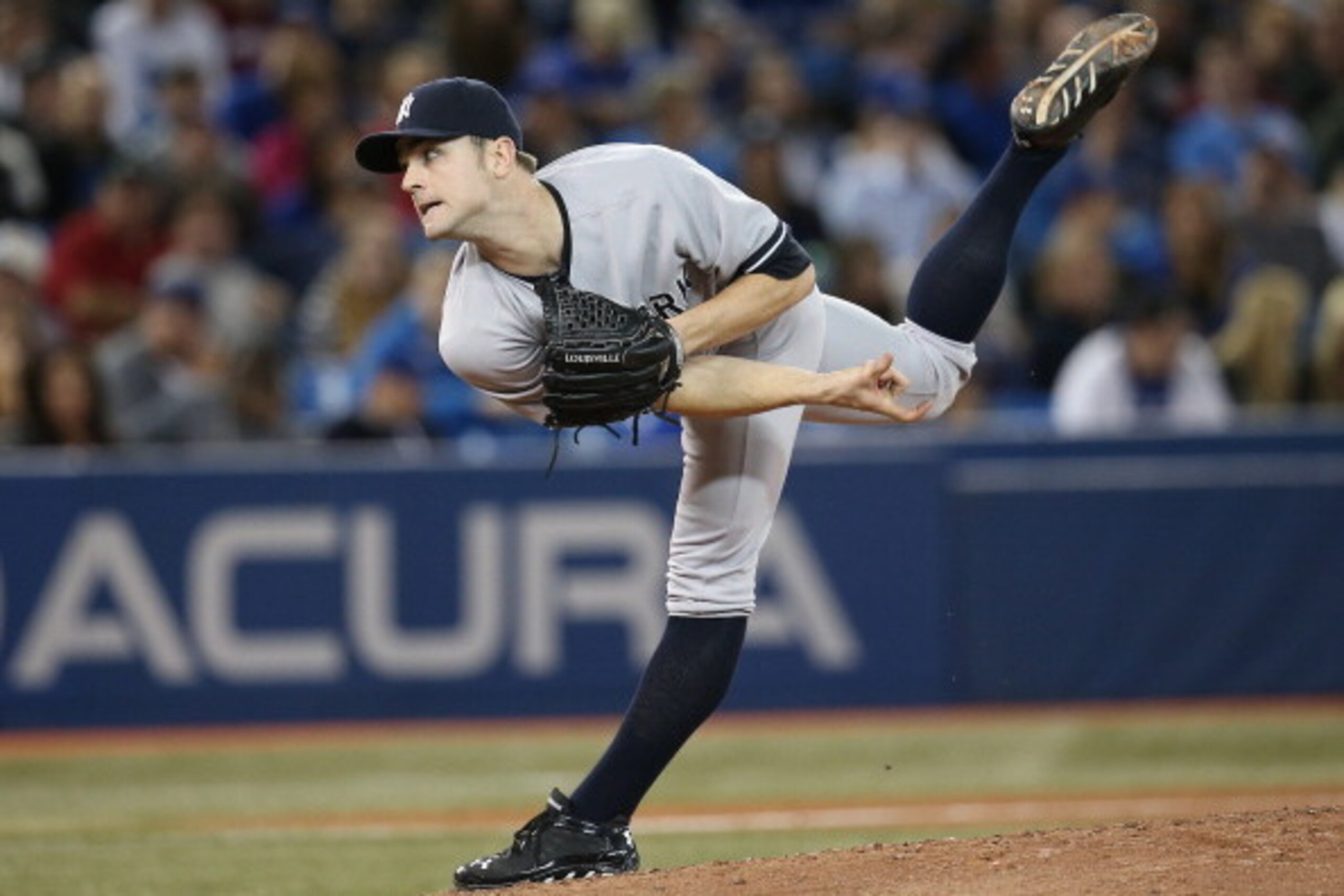 TORONTO, CANADA - SEPTEMBER 17:  David Robertson #30 of the New York Yankees delivers a pitch in the eighth inning during MLB game action against the Toronto Blue Jays on September 17, 2013 at Rogers Centre in Toronto, Ontario, Canada.  (Photo by Tom Szcz