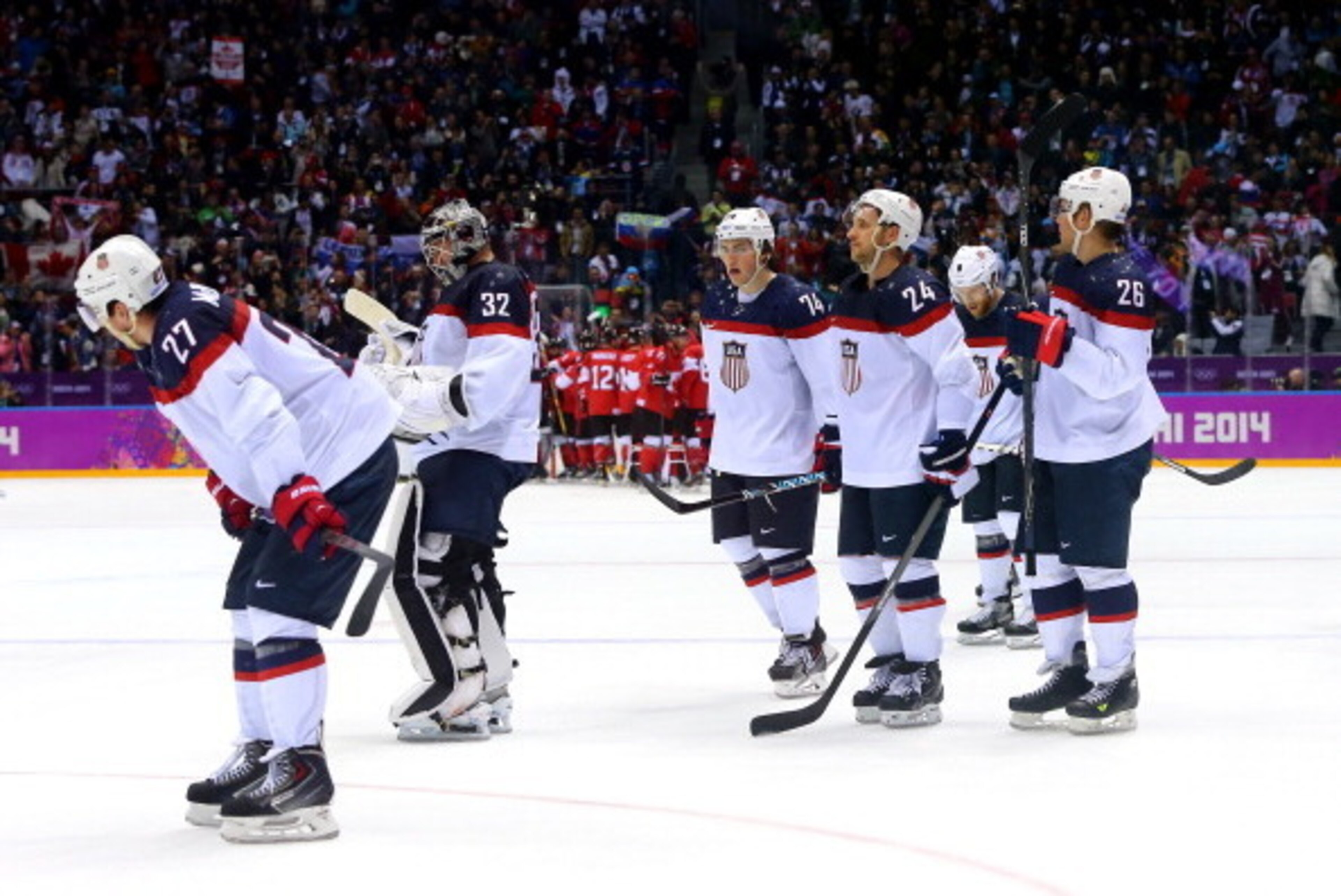SOCHI, RUSSIA - FEBRUARY 21:  The United States reacts after losing 1-0 to Canada during the Men's Ice Hockey Semifinal Playoff on Day 14 of the 2014 Sochi Winter Olympics at Bolshoy Ice Dome on February 21, 2014 in Sochi, Russia.  (Photo by Martin Rose/G