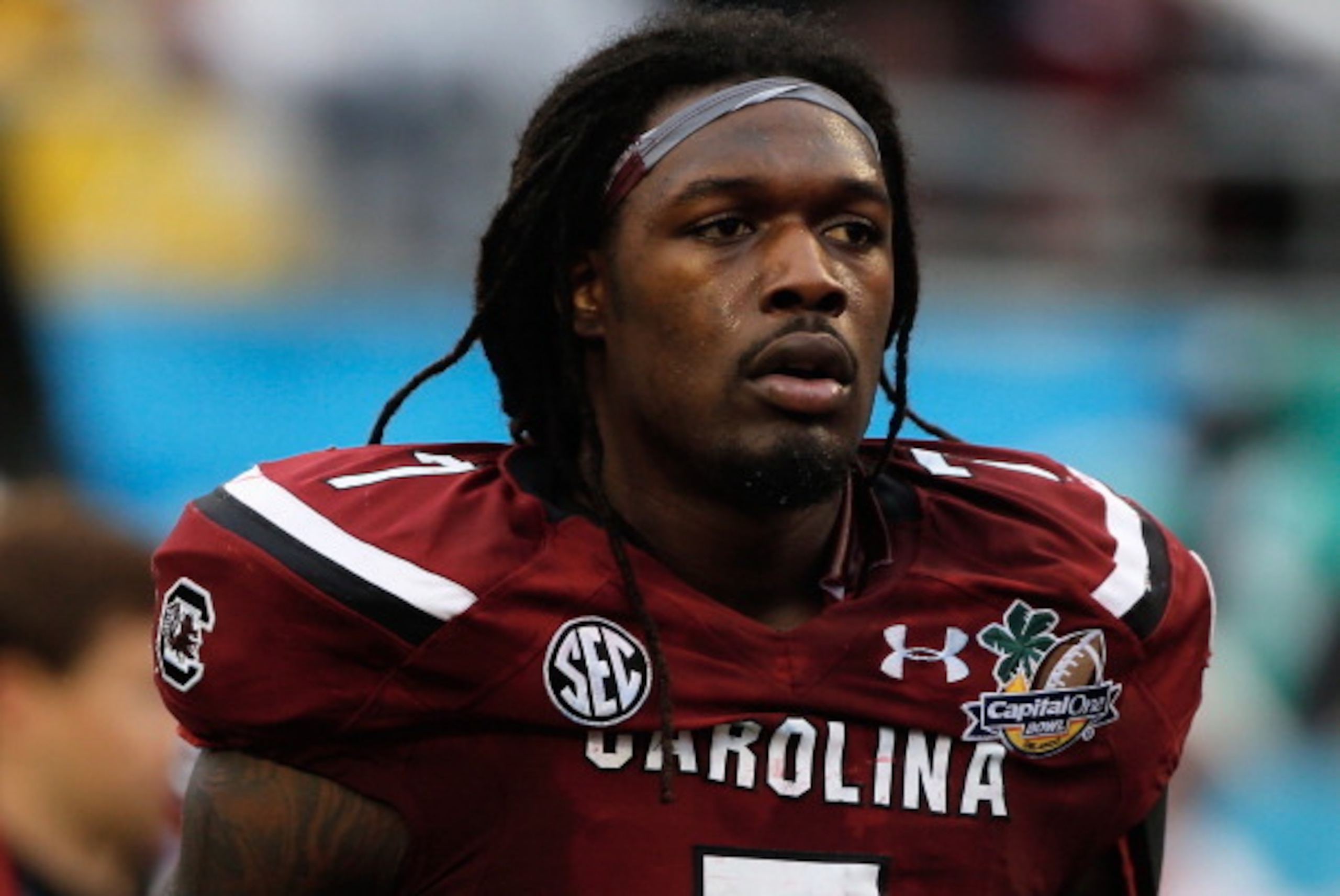 ORLANDO, FL - JANUARY 01:  Jadeveon Clowney #7 of the South Carolina Gamecocks walks off the field at the end of the first half of their game against the Wisconsin Badgers at the Capital One Bowl on January 1, 2014 in Orlando, Florida.  (Photo by Scott Ha