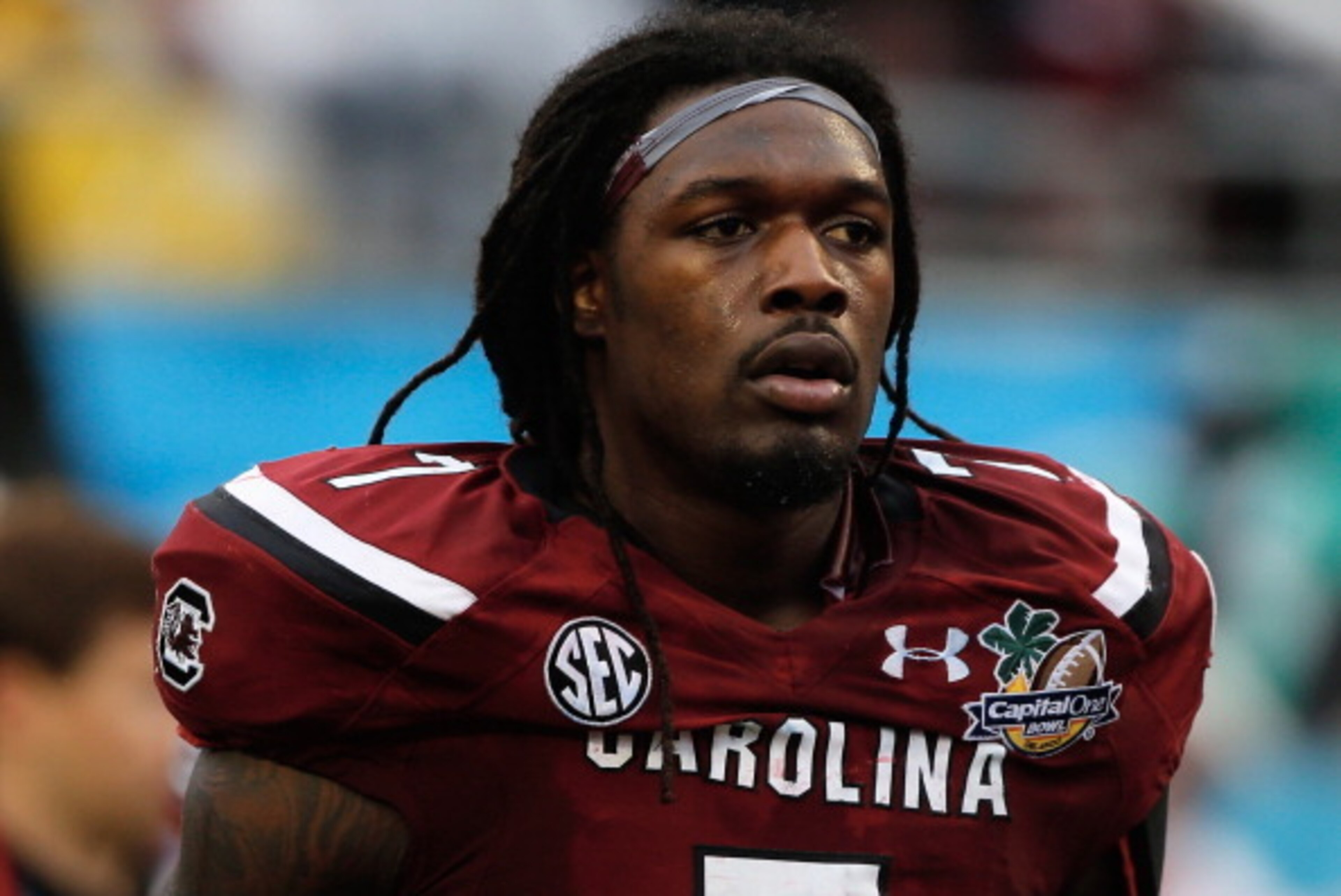 ORLANDO, FL - JANUARY 01:  Jadeveon Clowney #7 of the South Carolina Gamecocks walks off the field at the end of the first half of their game against the Wisconsin Badgers at the Capital One Bowl on January 1, 2014 in Orlando, Florida.  (Photo by Scott Ha