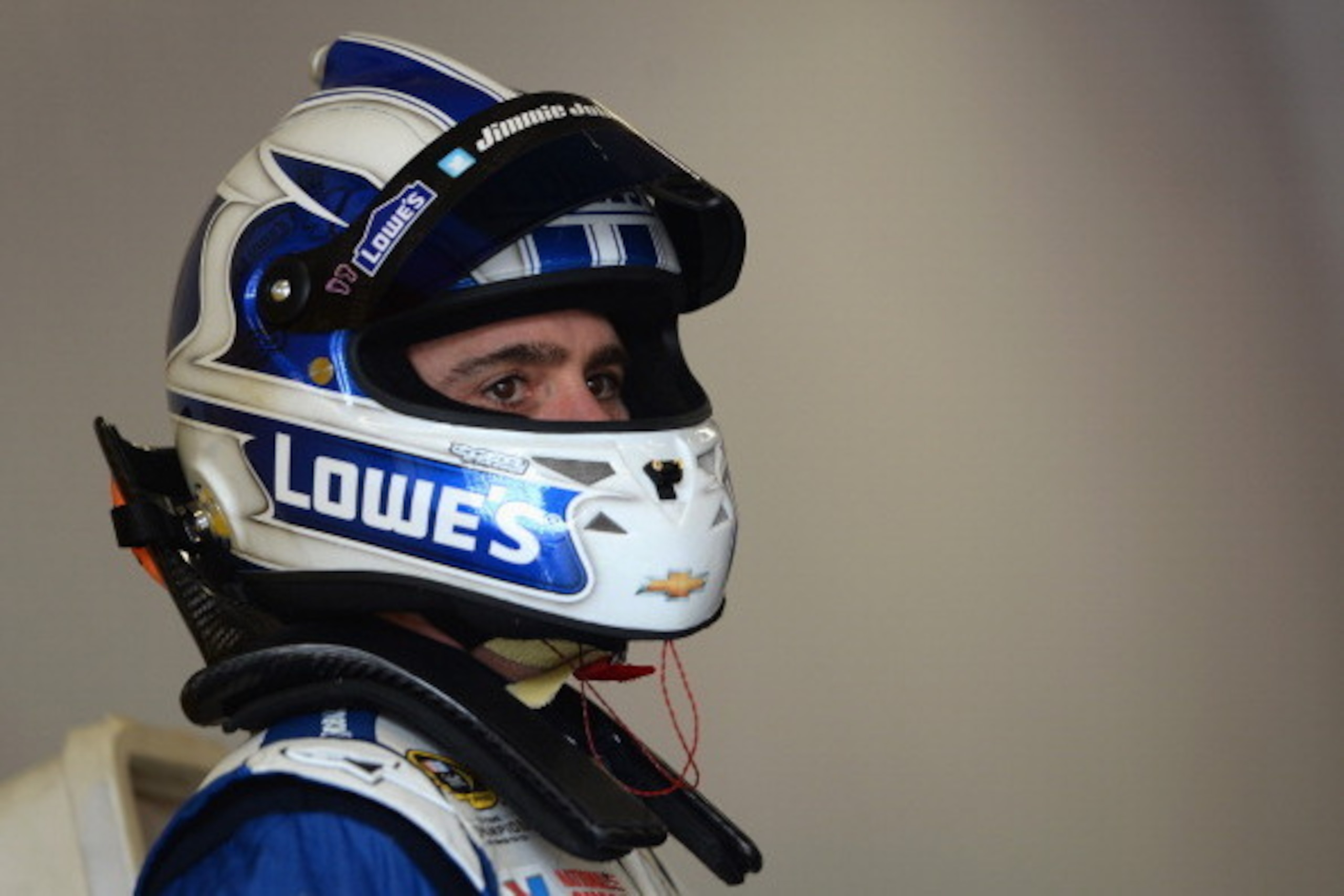 DAYTONA BEACH, FL - FEBRUARY 21:  Jimmie Johnson, driver of the #48 Lowe's Chevrolet, stands in the garage area during practice for the NASCAR Sprint Cup Series Daytona 500 at Daytona International Speedway on February 21, 2014 in Daytona Beach, Florida. 