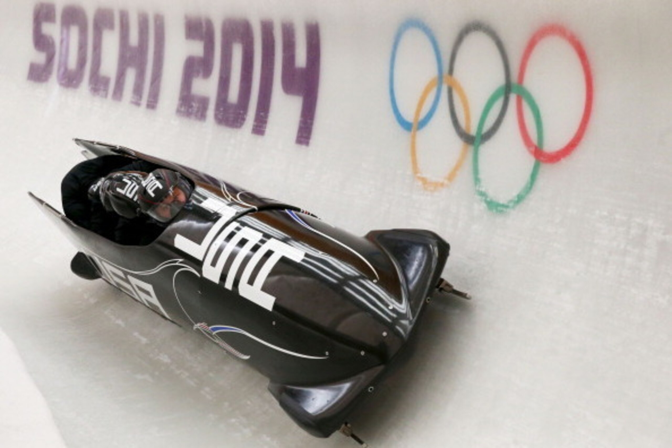 SOCHI, RUSSIA - FEBRUARY 19: Steven Holcomb of United States pilots a run during a four-man bobsleigh practice session on Day 12 of the Sochi 2014 Winter Olympics at Sliding Center Sanki on February 19, 2014 in Sochi, Russia. (Photo by Alex Livesey/Gett SOCHI, RUSSIA - FEBRUARY 19: Steven Holcomb of United States pilots a run during a four-man bobsleigh practice session on Day 12 of the Sochi 2014 Winter Olympics at Sliding Center Sanki on February 19, 2014 in Sochi, Russia. (Photo by Alex Livesey/Gett