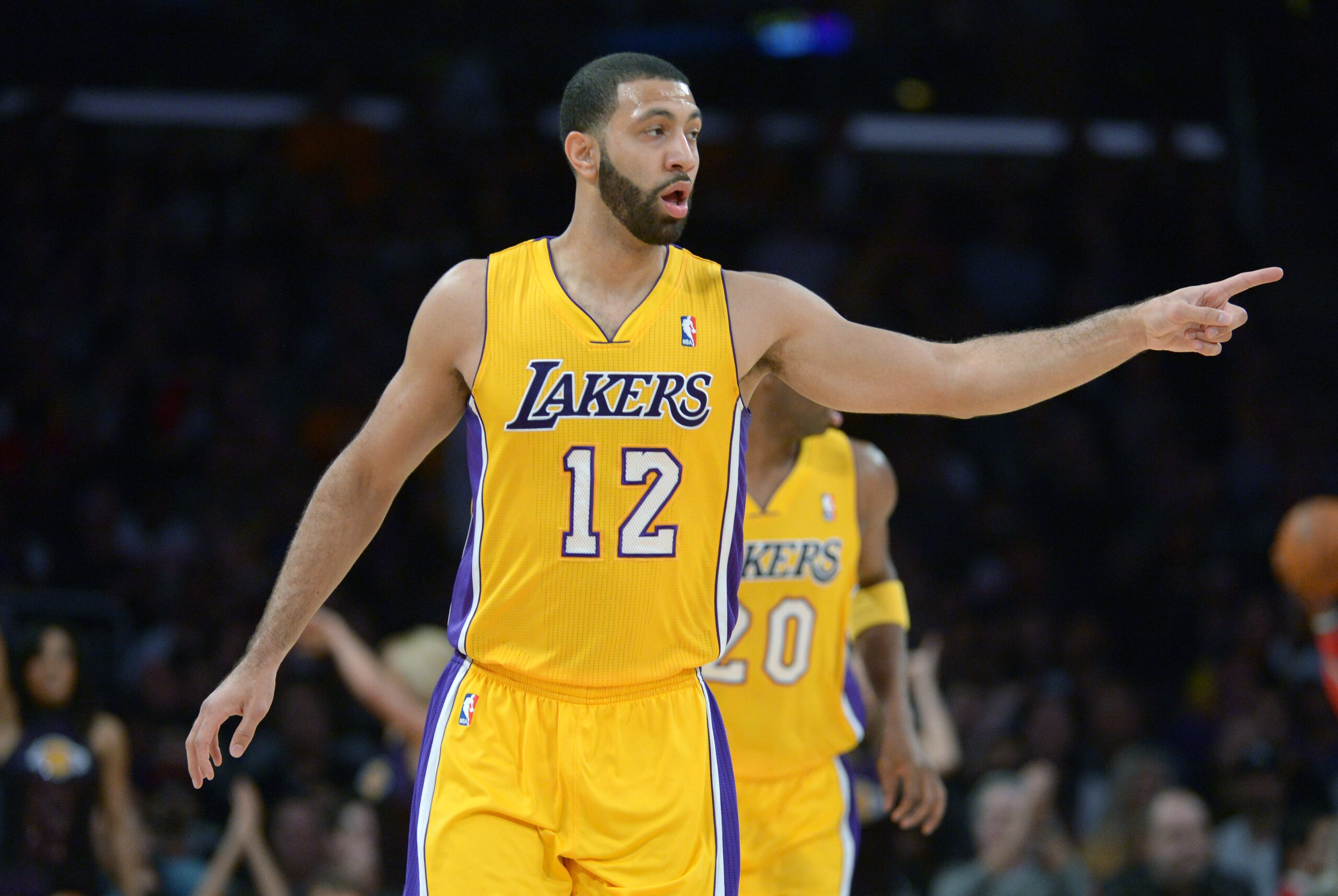 Feb 19, 2014; Los Angeles, CA, USA; Los Angeles Lakers guard Kendall Marshall (12) reacts against the Houston Rockets at Staples Center. The Rockets defeated the Lakers 134-108. Mandatory Credit: Kirby Lee-USA TODAY Sports