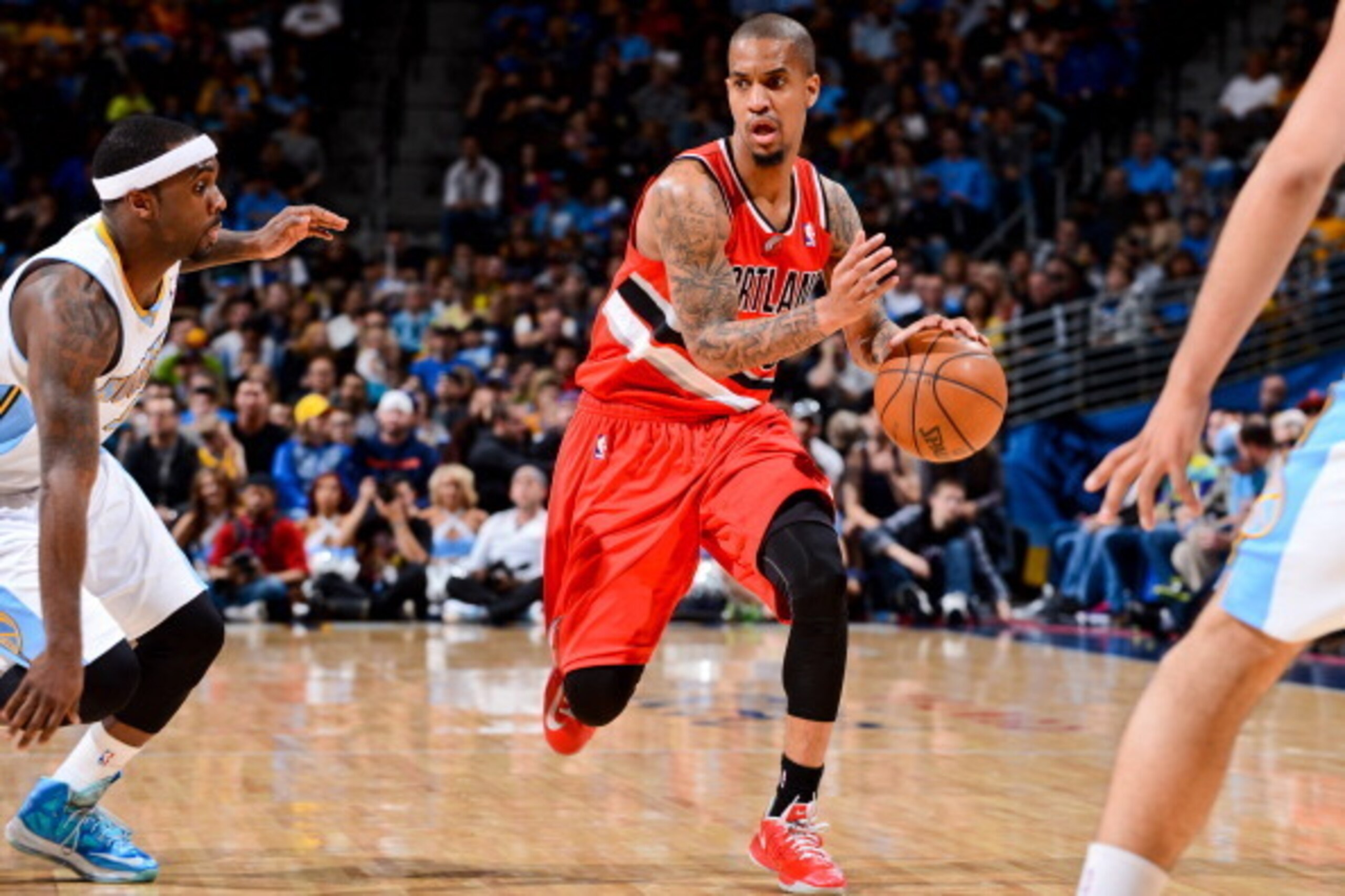 DENVER, CO - APRIL 14: Eric Maynor #6 of the Portland Trail Blazers drives against Ty Lawson #3 of the Denver Nuggets on April 14, 2013 at the Pepsi Center in Denver, Colorado. NOTE TO USER: User expressly acknowledges and agrees that, by downloading and/