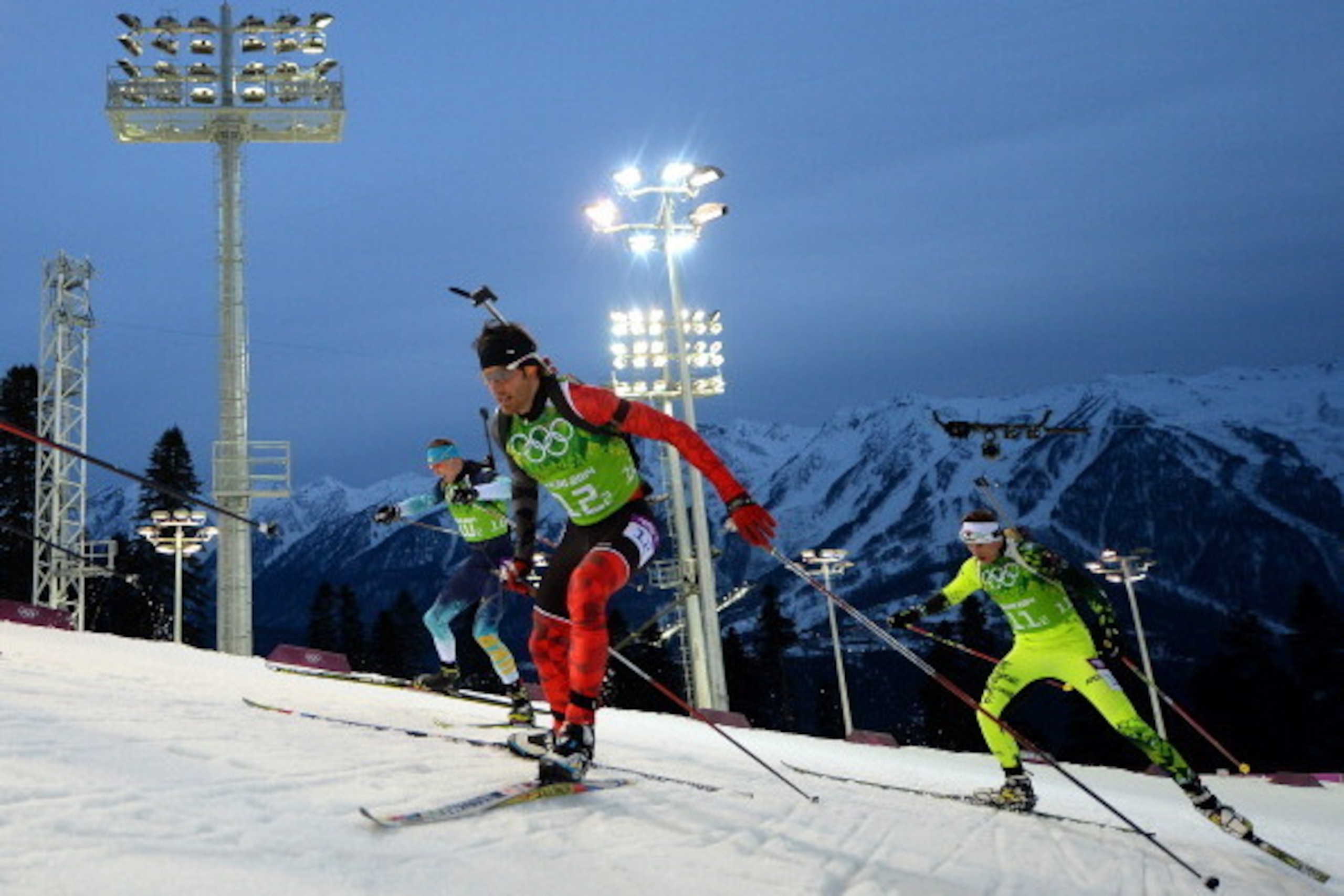 SOCHI, RUSSIA - FEBRUARY 22: Scott Perras (L) of Canada and Tomas Hasilla of Slovakia compete during the Men's 4 x 7.5 km Relay during day 15 of the Sochi 2014 Winter Olympics at Laura Cross-country Ski & Biathlon Center on February 22, 2014 in Sochi, Ru SOCHI, RUSSIA - FEBRUARY 22: Scott Perras (L) of Canada and Tomas Hasilla of Slovakia compete during the Men's 4 x 7.5 km Relay during day 15 of the Sochi 2014 Winter Olympics at Laura Cross-country Ski & Biathlon Center on February 22, 2014 in Sochi, Ru