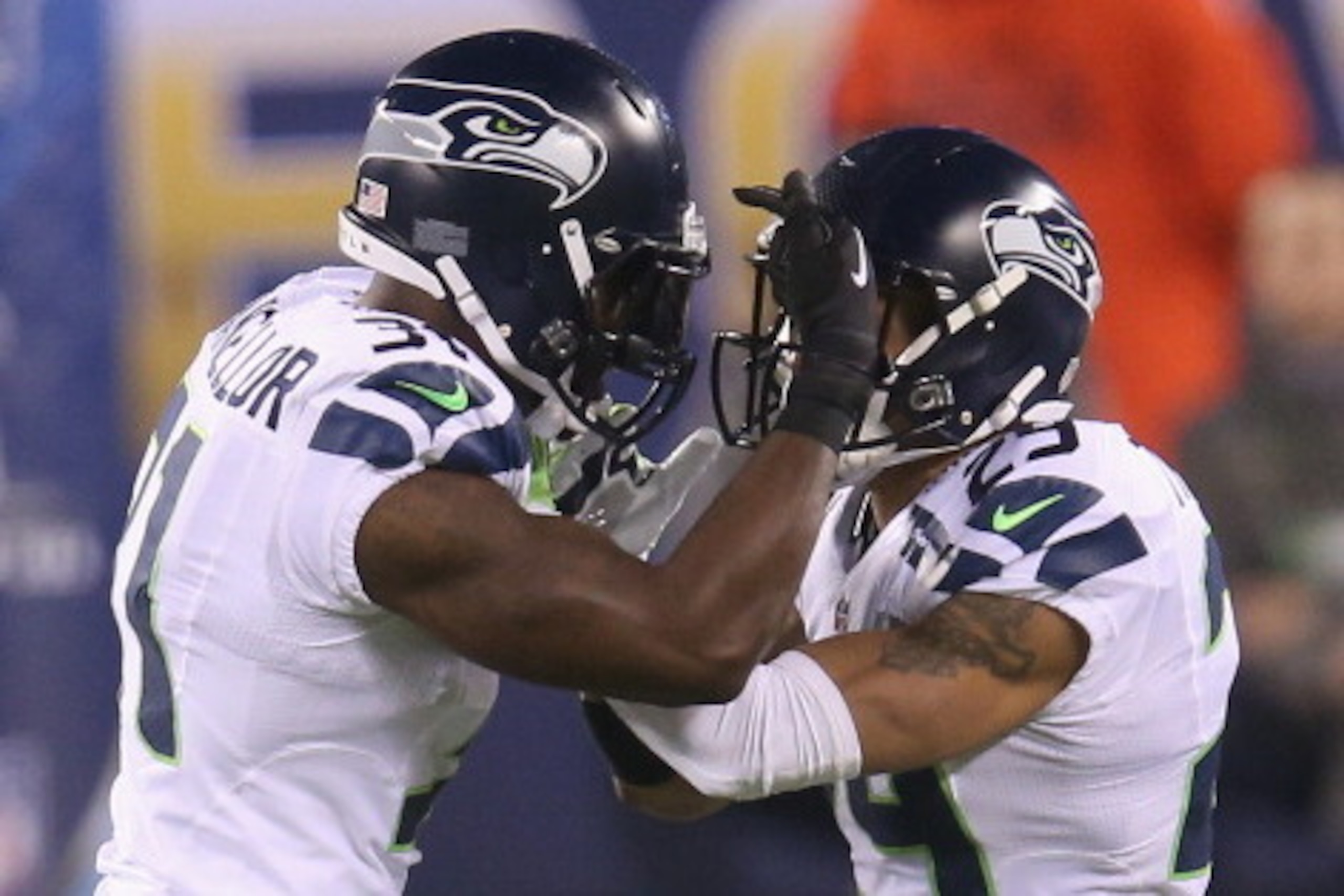 EAST RUTHERFORD, NJ - FEBRUARY 02:  Strong safety Kam Chancellor #31 of the Seattle Seahawks celebrates his interception with teammate free safety Earl Thomas #29 against the Denver Broncos in the first quarter during Super Bowl XLVIII at MetLife Stadium 