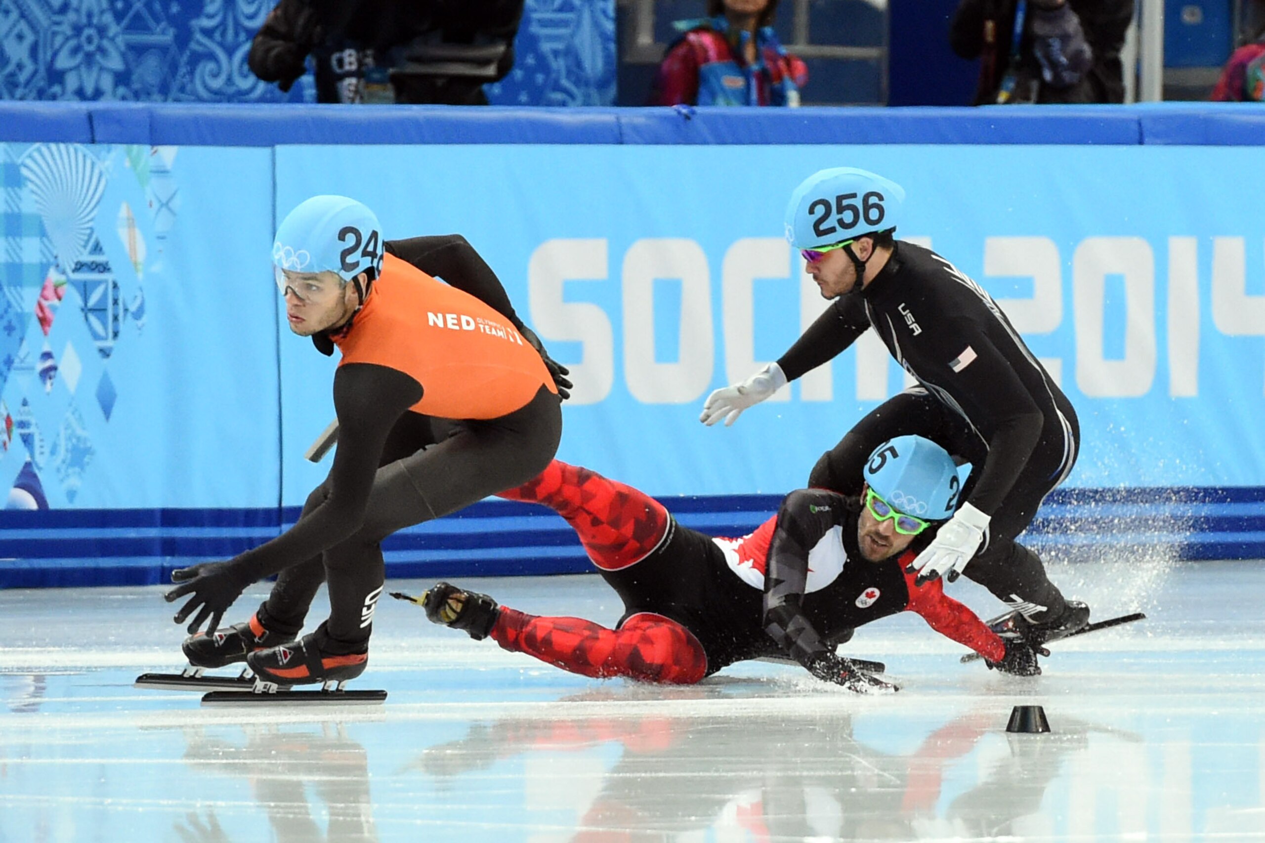 Feb 15, 2014; Sochi, RUSSIA; Charles Hamelin (CAN, 205) falls and takes out Eduardo Alvarez (USA, 256) in the mens' short track speedskating 1000m quarterfinals during the Sochi 2014 Olympic Winter Games at Iceberg Skating Palace. Mandatory Credit: Robert