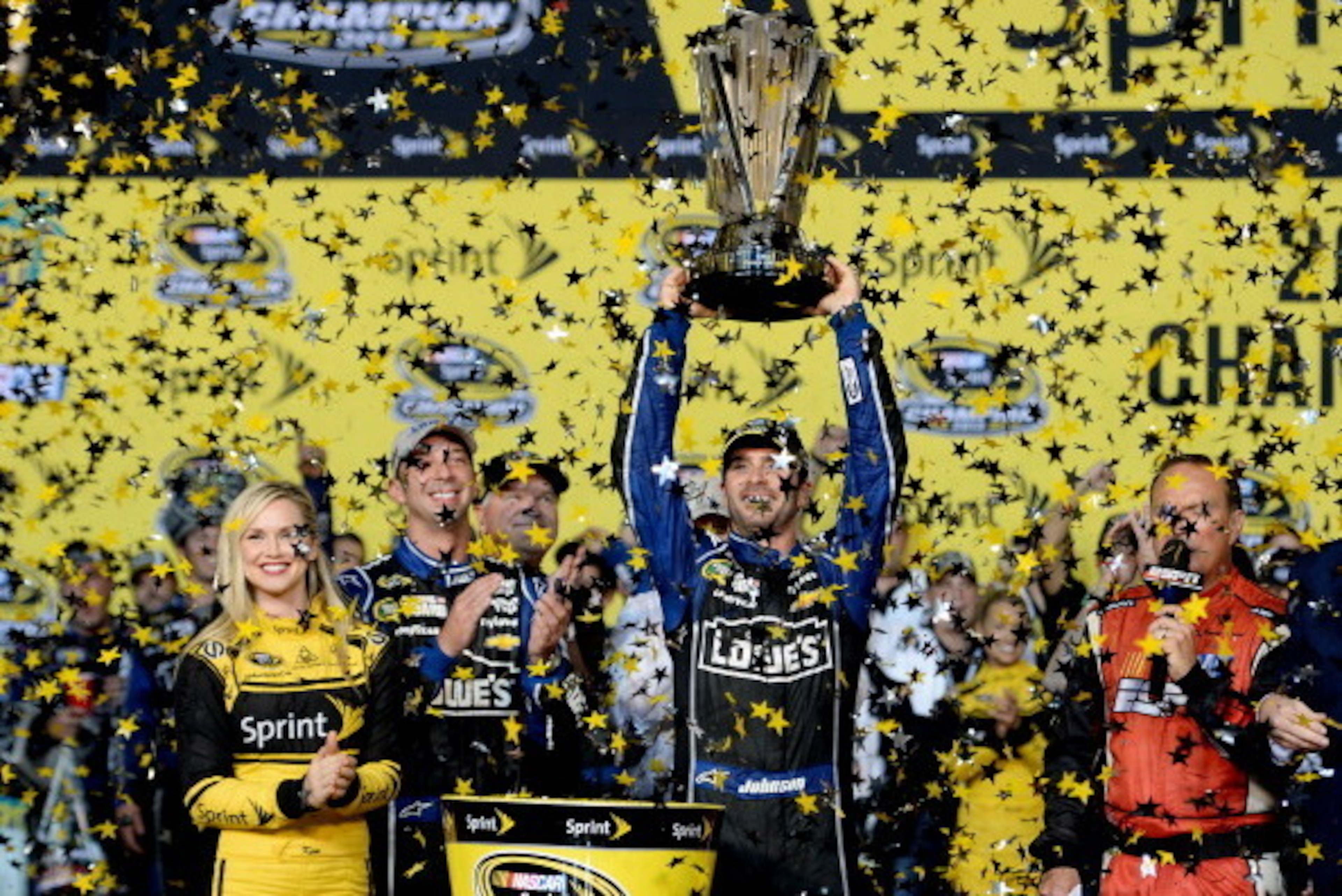 HOMESTEAD, FL - NOVEMBER 17: Jimmie Johnson, driver of the #48 Lowe's/Kobalt Tools Chevrolet, celebrates with champagne in Champions Victory Lane after winning the series championship following the NASCAR Sprint Cup Series Ford EcoBoost 400 at Homestead- HOMESTEAD, FL - NOVEMBER 17: Jimmie Johnson, driver of the #48 Lowe's/Kobalt Tools Chevrolet, celebrates with champagne in Champions Victory Lane after winning the series championship following the NASCAR Sprint Cup Series Ford EcoBoost 400 at Homestead-