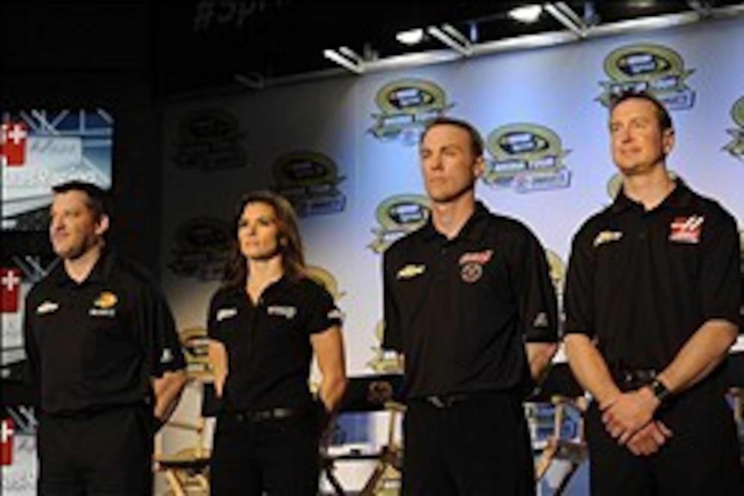 Jan 27, 2014; Charlotte, NC, USA; Stewart Haas team drivers from left to right,  Tony Stewart (14) , Danica Patrick (10) , Kevin Harvick (4) and Kurt Busch (41) prepare to address the media during the Sprint Media Tour at the Charlotte Convention Center. 