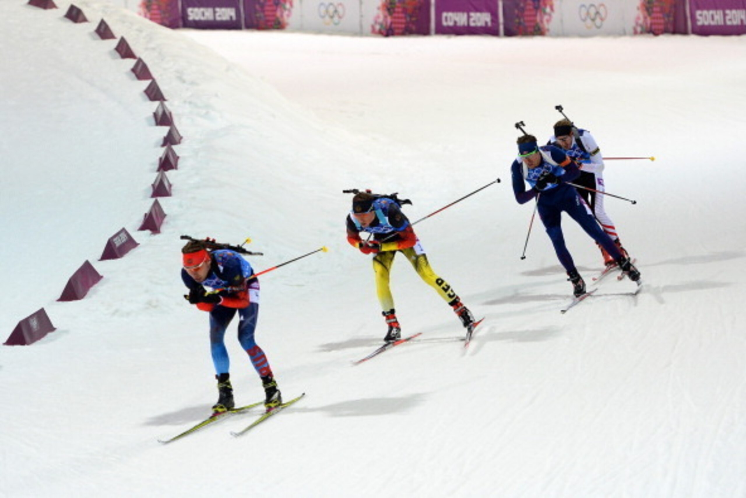 SOCHI, RUSSIA - FEBRUARY 22: (L-R) Anton Shipulin of Russia leads Simon Schempp of Germany, Emil Hegle Svendsen of Norway and Dominik Landertinger of Austria during the Men's 4 x 7.5 km Relay during day 15 of the Sochi 2014 Winter Olympics at Laura Cross SOCHI, RUSSIA - FEBRUARY 22: (L-R) Anton Shipulin of Russia leads Simon Schempp of Germany, Emil Hegle Svendsen of Norway and Dominik Landertinger of Austria during the Men's 4 x 7.5 km Relay during day 15 of the Sochi 2014 Winter Olympics at Laura Cross