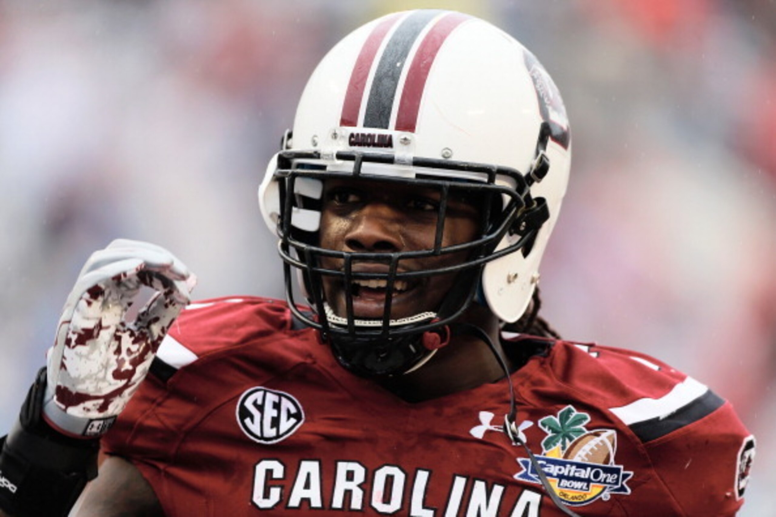 ORLANDO, FL - JANUARY 01:  Jadeveon Clowney #7 of the South Carolina Gamecocks works out on the field before the start of their game against the Wisconsin Badgers at the Capital One Bowl on January 1, 2014 in Orlando, Florida.  (Photo by Scott Halleran/Ge