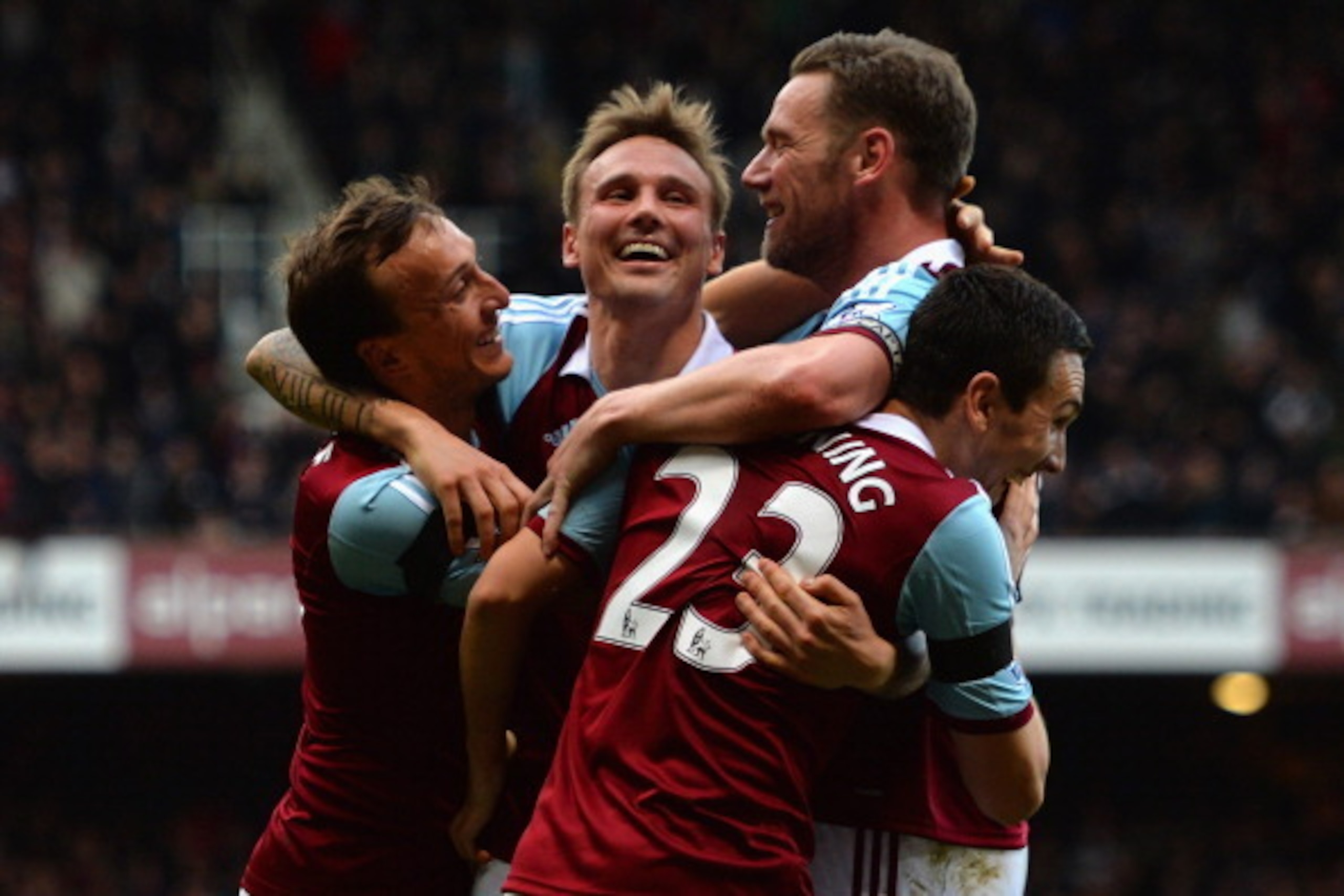 LONDON, ENGLAND - FEBRUARY 22:  Mark Noble, Matt Taylor, Kevin Nolan and Stewart Downing of West Ham celebrates their third goal during the Barclays Premier League match between West Ham United and Southampton at Boleyn Ground on February 22, 2014 in Lond