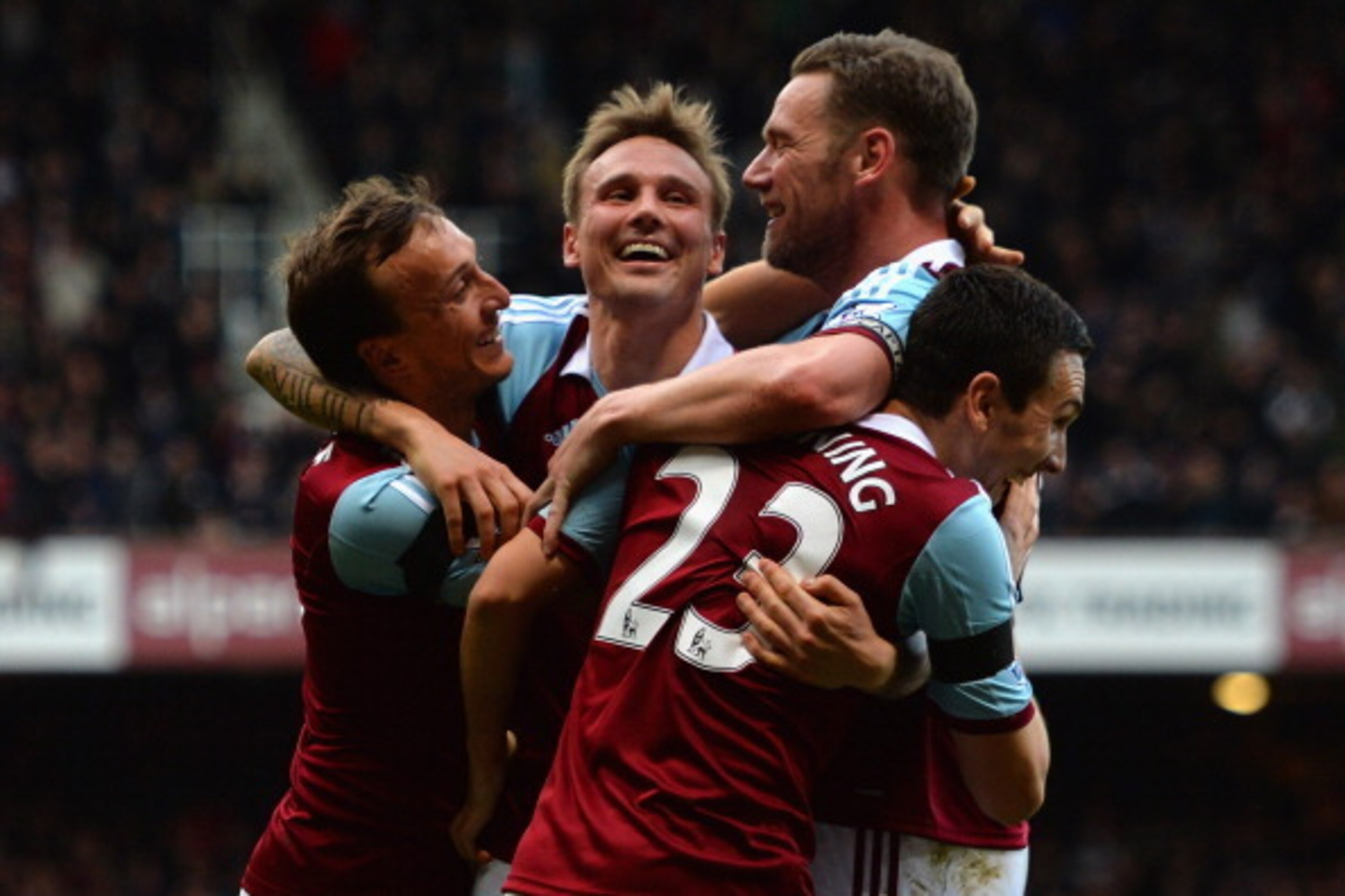 LONDON, ENGLAND - FEBRUARY 22:  Mark Noble, Matt Taylor, Kevin Nolan and Stewart Downing of West Ham celebrates their third goal during the Barclays Premier League match between West Ham United and Southampton at Boleyn Ground on February 22, 2014 in Lond