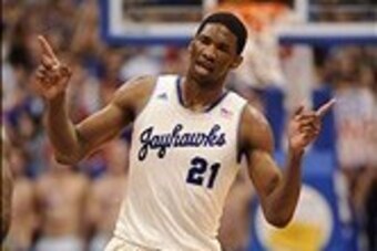 Feb 22, 2014; Lawrence, KS, USA; Kansas Jayhawks center Joel Embiid (21) celebrates after scoring in the first half against the Texas Longhorns at Allen Fieldhouse. Mandatory Credit: Denny Medley-USA TODAY Sports