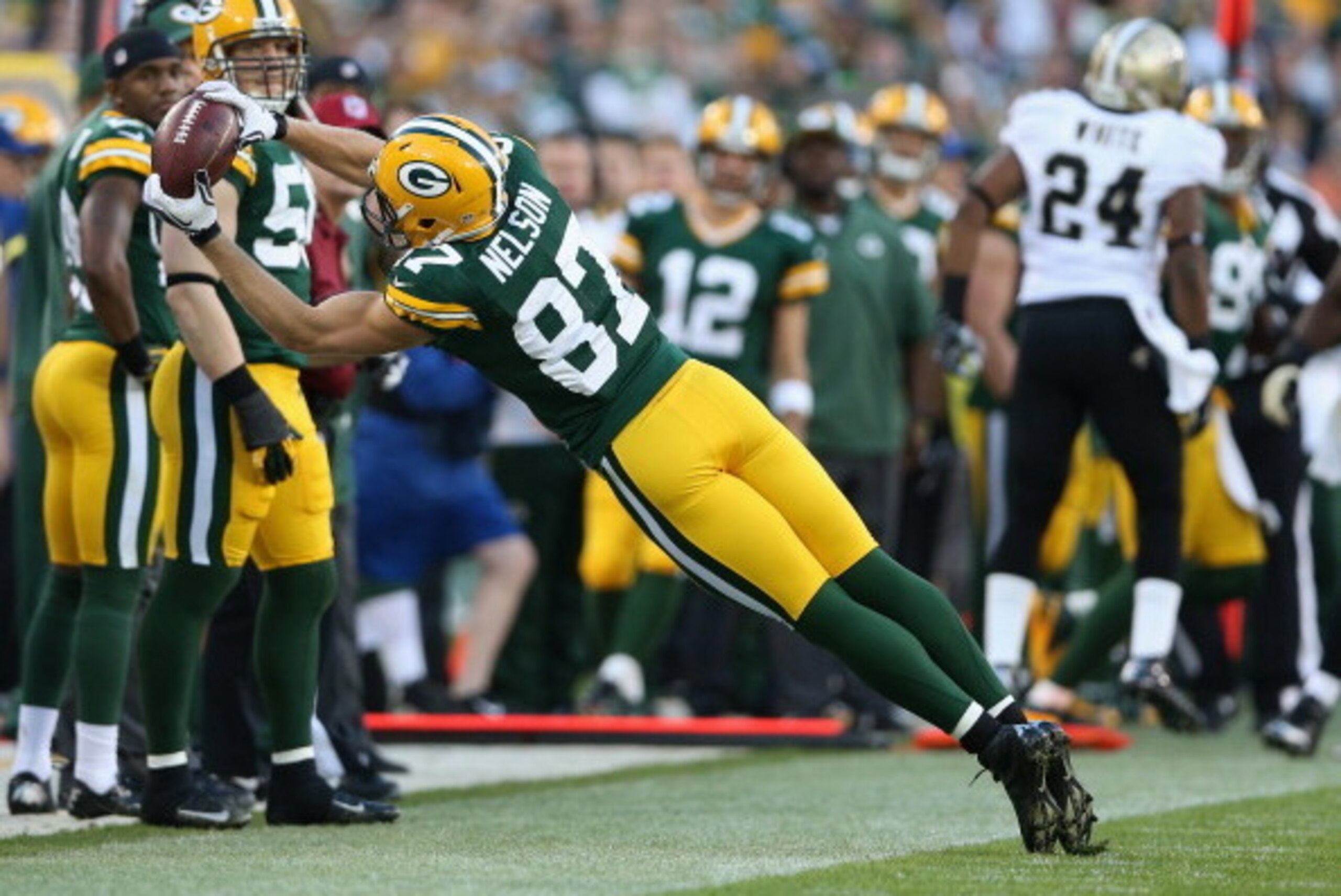 GREEN BAY, WI - SEPTEMBER 30:  Wide receiver Jordy Nelson #87 of the Green Bay Packers appears to make a catch against the New Orleans Saints in the fourth quarter, but it was ruled an incomplete pass at Lambeau Field on September 30, 2012 in Green Bay, W