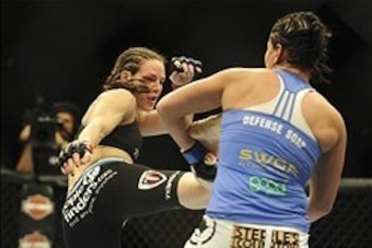 Feb 22, 2014; Las Vegas, NV, USA; Jessica Eye (blue gloves) attempts to block a kick from Alexis Davis (red gloves) during their UFC bantamweight bout at Mandalay Bay. Davis won by split decision. Mandatory Credit: Stephen R. Sylvanie-USA TODAY Sports Feb 22, 2014; Las Vegas, NV, USA; Jessica Eye (blue gloves) attempts to block a kick from Alexis Davis (red gloves) during their UFC bantamweight bout at Mandalay Bay. Davis won by split decision. Mandatory Credit: Stephen R. Sylvanie-USA TODAY Sports