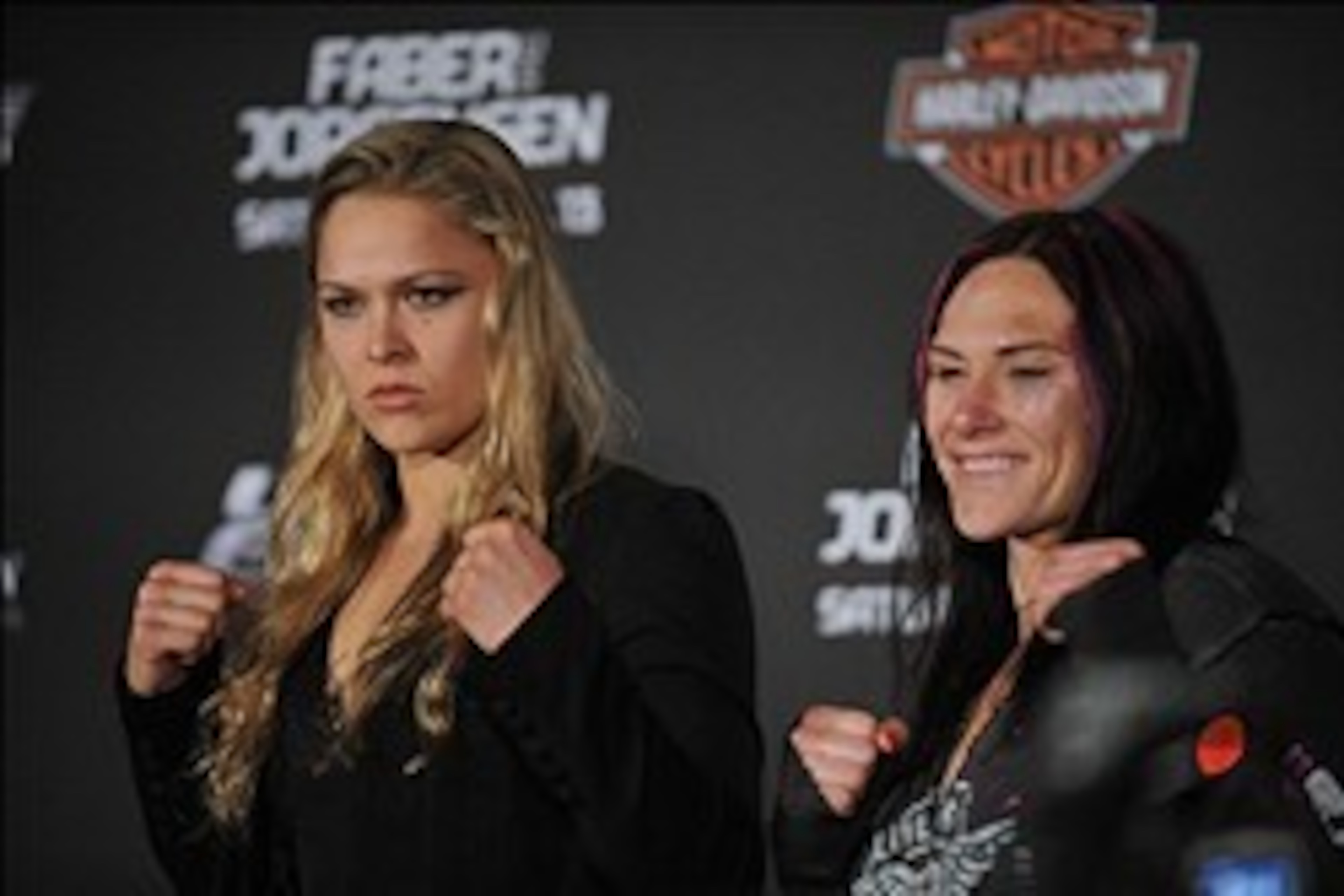 April 13, 2013; Las Vegas, NV, USA; Ronda Rousey (left) poses for photographs with Cat Zingano following the TUF 17 Finale at the Mandalay Bay Events Center. Mandatory Credit: Gary A. Vasquez-USA TODAY Sports