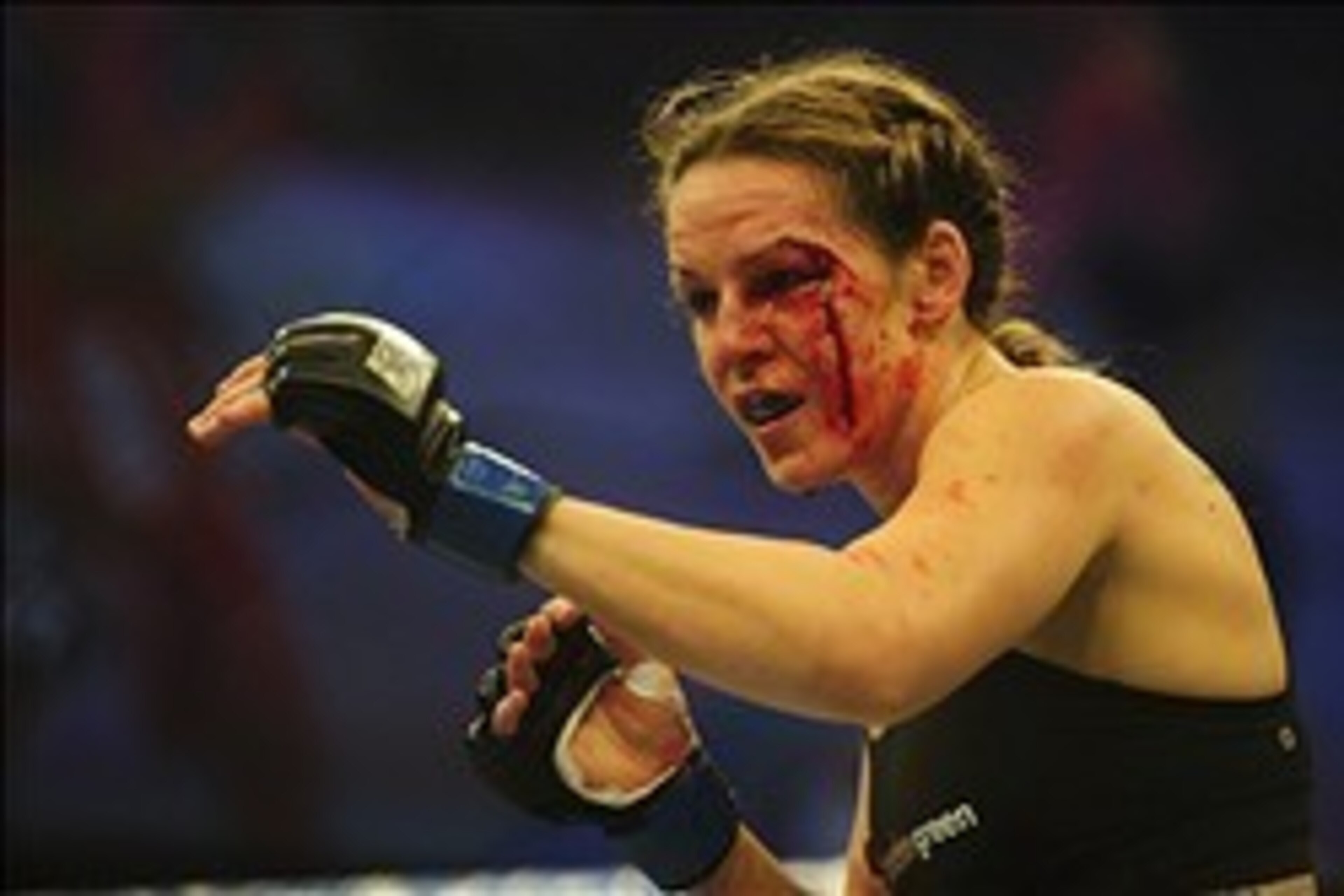 Nov 6, 2013; Fort Campbell, KY, USA; Alexis Davis (blue gloves) fights Liz Carmouche (red gloves) in the women's bantamweight bout during UFC Fight for the Troops at Fort Campbell. Mandatory Credit: Joshua Lindsey-USA TODAY Sports Nov 6, 2013; Fort Campbell, KY, USA; Alexis Davis (blue gloves) fights Liz Carmouche (red gloves) in the women's bantamweight bout during UFC Fight for the Troops at Fort Campbell. Mandatory Credit: Joshua Lindsey-USA TODAY Sports