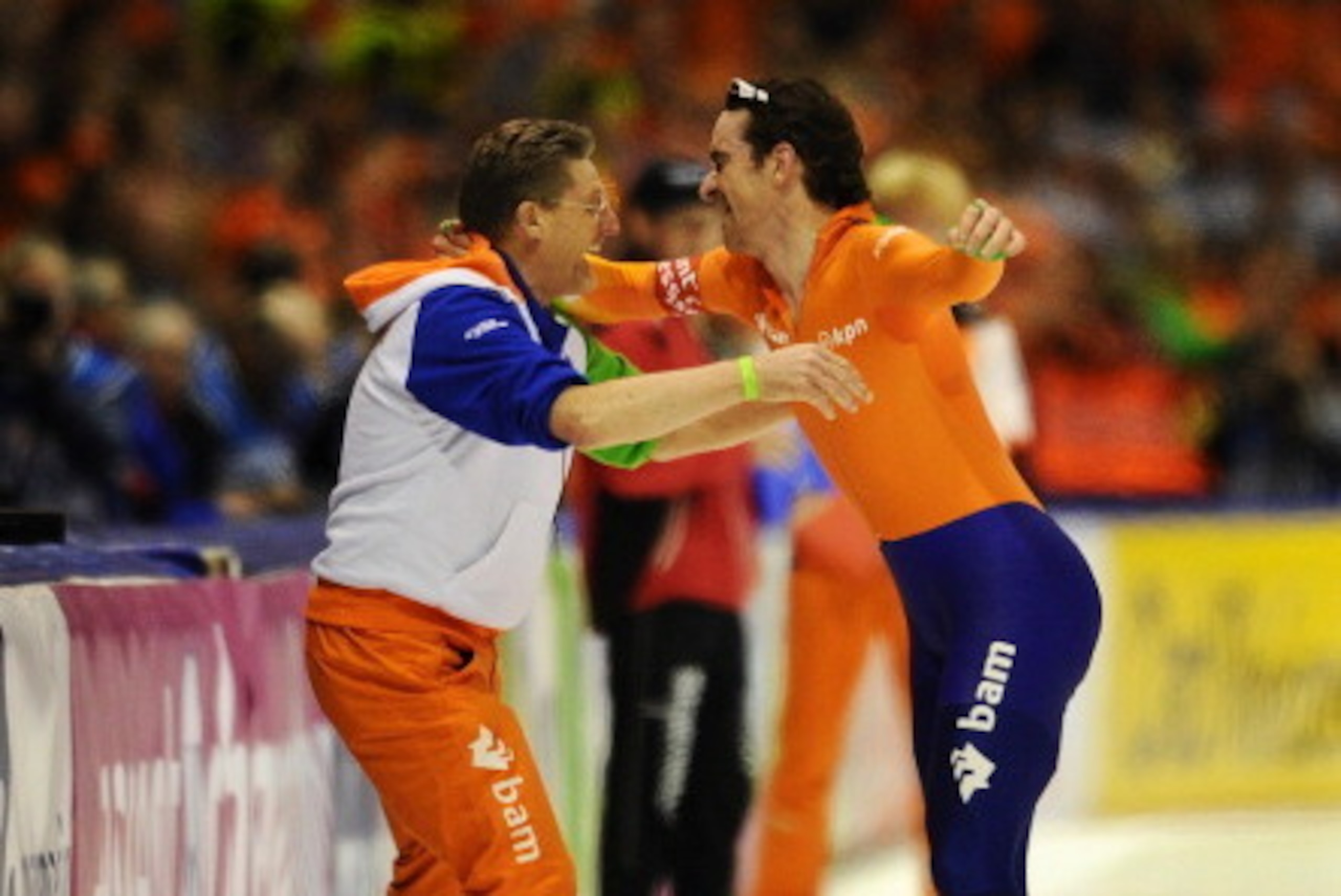 HEERENVEEN, NETHERLANDS - MARCH 24:  Bob de Jong (R) of the Netherlands celebrates with his coach Jillert Anema after clocking the fastest time at the 10000m race at the Essent ISU World Single Distances Championship Speed Skating at the Thialf Stadium on