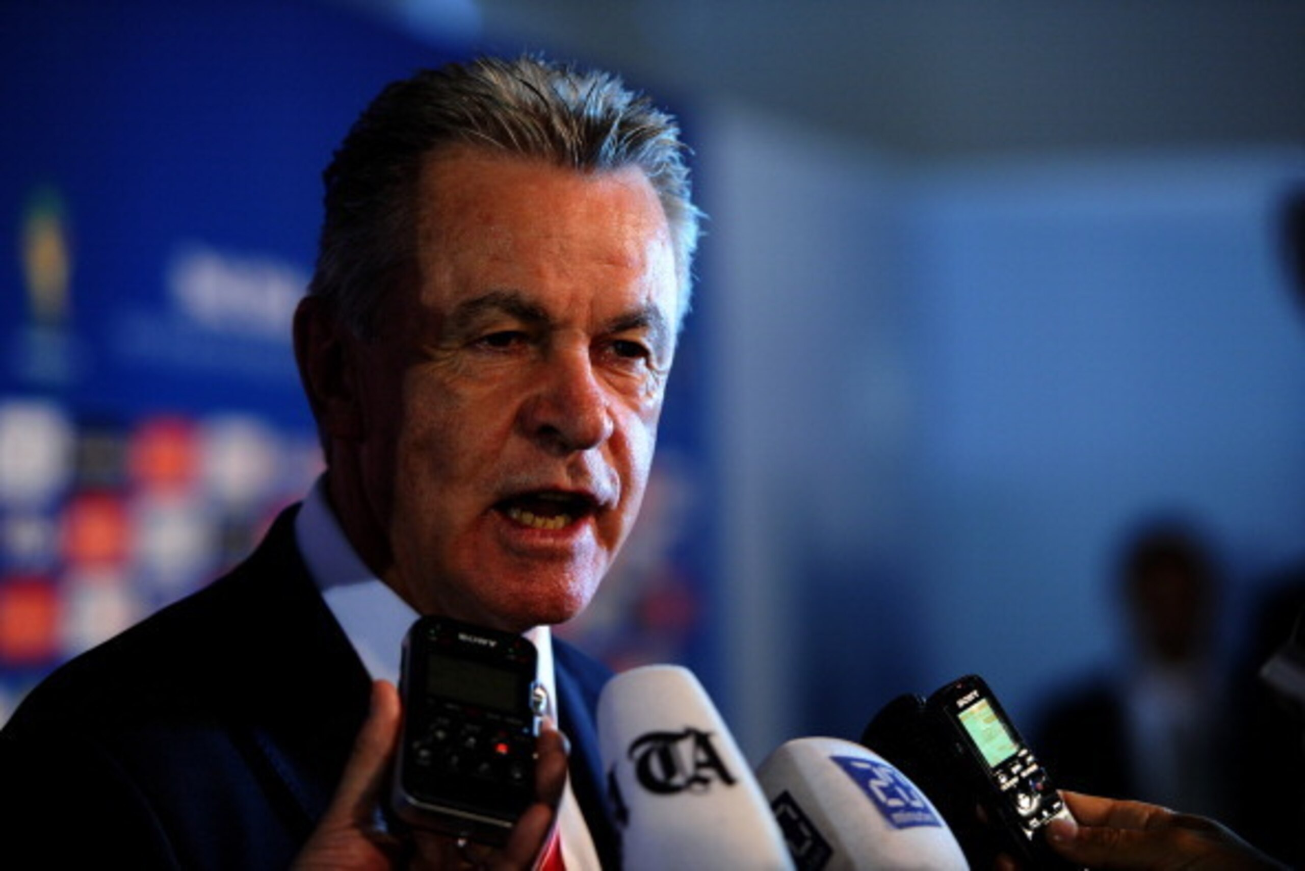 COSTA DO SAUIPE, BRAZIL - DECEMBER 06:  Switzerland coach Ottmar Hitzfeld speaks to members of the media after the Final Draw for the 2014 FIFA World Cup Brazil at Costa do Sauipe Resort on December 6, 2013 in Costa do Sauipe, Bahia, Brazil.  (Photo by Bu