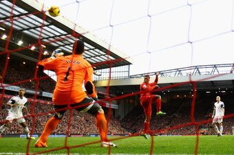 LIVERPOOL, ENGLAND - FEBRUARY 23:  Daniel Sturridge of Liverpool scores his team's third goal during the Barclays Premier League match between Liverpool and Swansea City at Anfield on February 23, 2014 in Liverpool, England.  (Photo by Clive Brunskill/Get